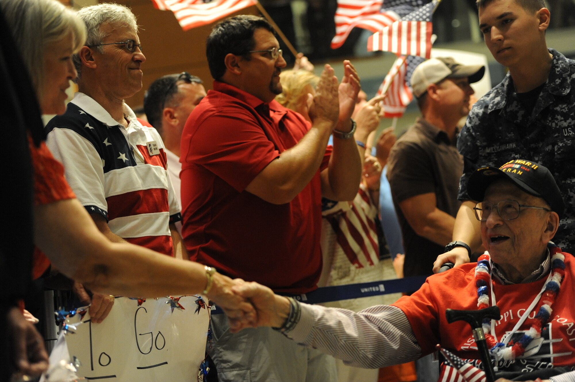 A World War II veteran is greeted at the Gulfport/Biloxi International Airport after returning from the Mississippi Gulf Coast Honor Flight to Washington, D.C., Oct 1, 2013. The Honor Flight is a nonprofit program that sends veterans to see national monuments in Washington, D.C., to honor them for their service. (U.S. Air Force photos by Airman 1st Class Stephan Coleman)