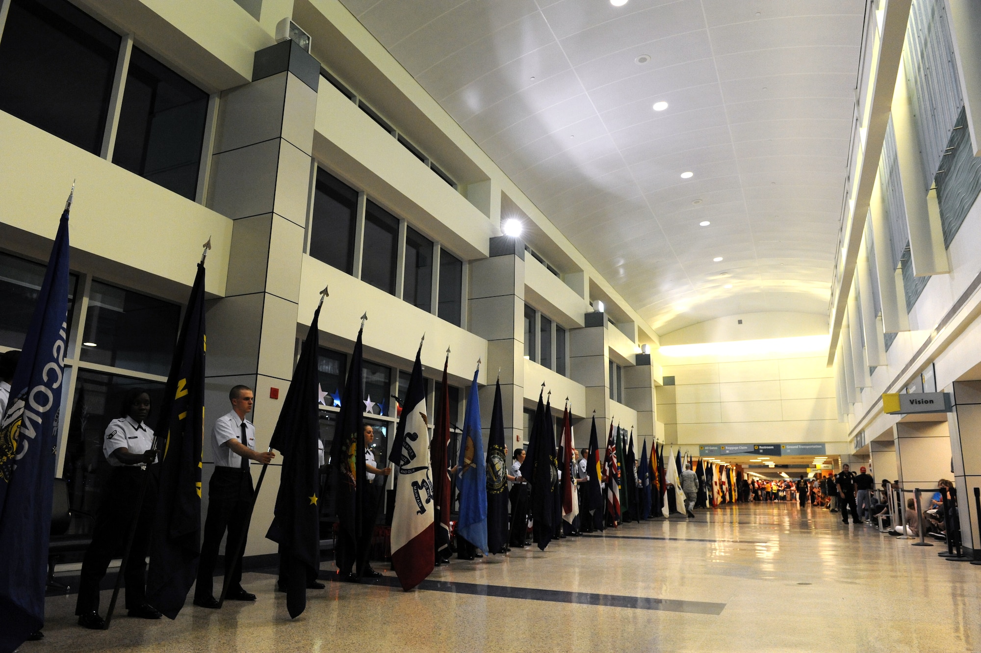 Keesler Airmen line the Gulfport/Biloxi International Airport with flags in preparation for the arrival of World War II veterans with the Mississippi Gulf Coast Honor Flight from Washington, D.C., Oct 1, 2013. The Honor Flight is a nonprofit program that sends veterans to Washington, D.C., to see national monuments. (U.S. Air Force photos by Airman 1st Class Stephan Coleman)