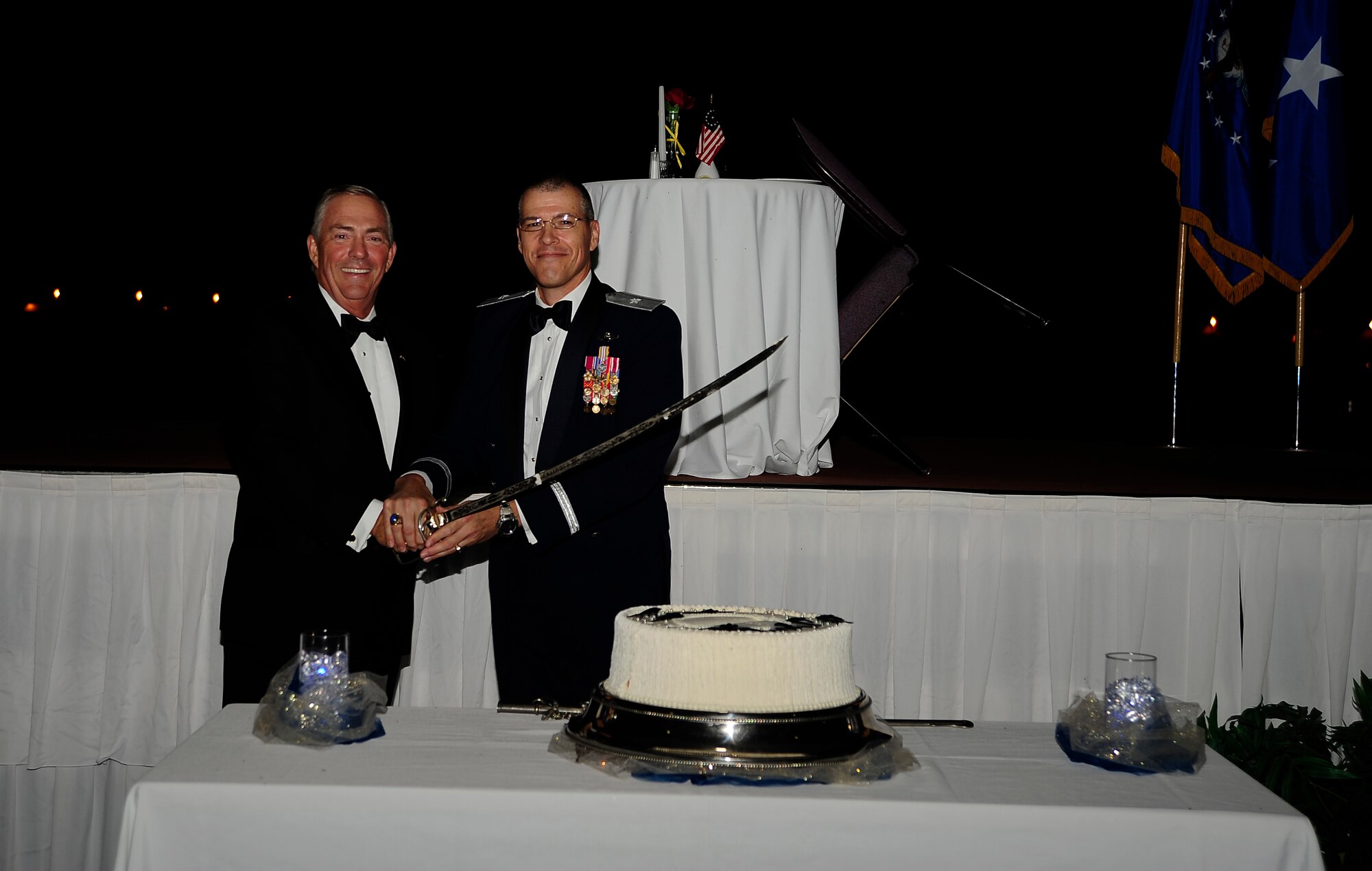 Retired Lt. Gen. Ronald Marcotte, left, vice commander of Air Mobility Command, and Brig. Gen. Thomas Bussiere, 509th Bomb Wing commander, cut the cake during the Year of the B-2 Gala Sept. 28, 2013, at Whiteman Air Force Base, Mo. Marcotte was the commander of the 509th Bomb Wing when the first B-2 Spirit arrived at Whiteman in 1993. (U.S. Air Force photo by Staff Sgt. Brigitte N. Brantley/Released)