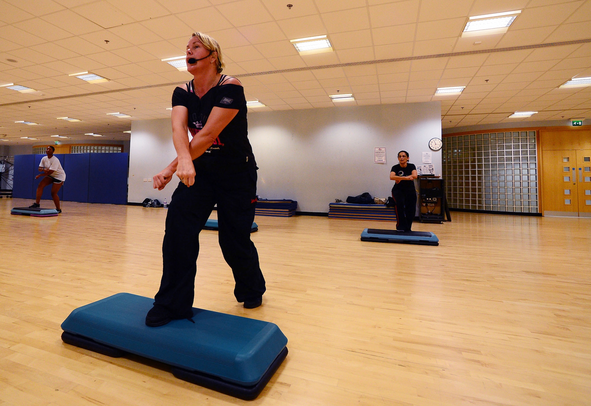 Lorraine Botwright, 48th Force Support Squadron Fitness Center instructor, leads a class on latin/urban dance class at the Royal Air Force Lakenheath Fitness Center Oct. 1, 2013. The biweekly class offers a dance workout to latin and urban music Tuesdays and Thursdays at 11 a.m. (U.S. Air Force photo by Senior Airman Tiffany M. Grigg/Released)  