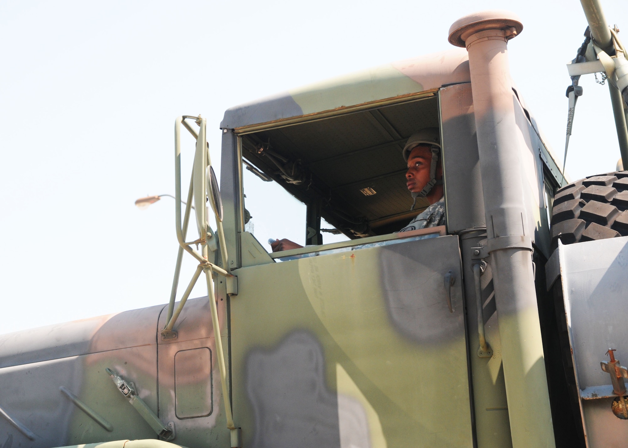 Spc. Camille David, 414th Transportation Company, drives a 5-ton Army truck from Fort Bragg, N.C., Sept. 10 on a vehicle divestiture mission to Joint Base McGuire-Dix-Lakehurst, N.J. (U.S. Army photo by Sgt. Elisebet Freeburg/Released)