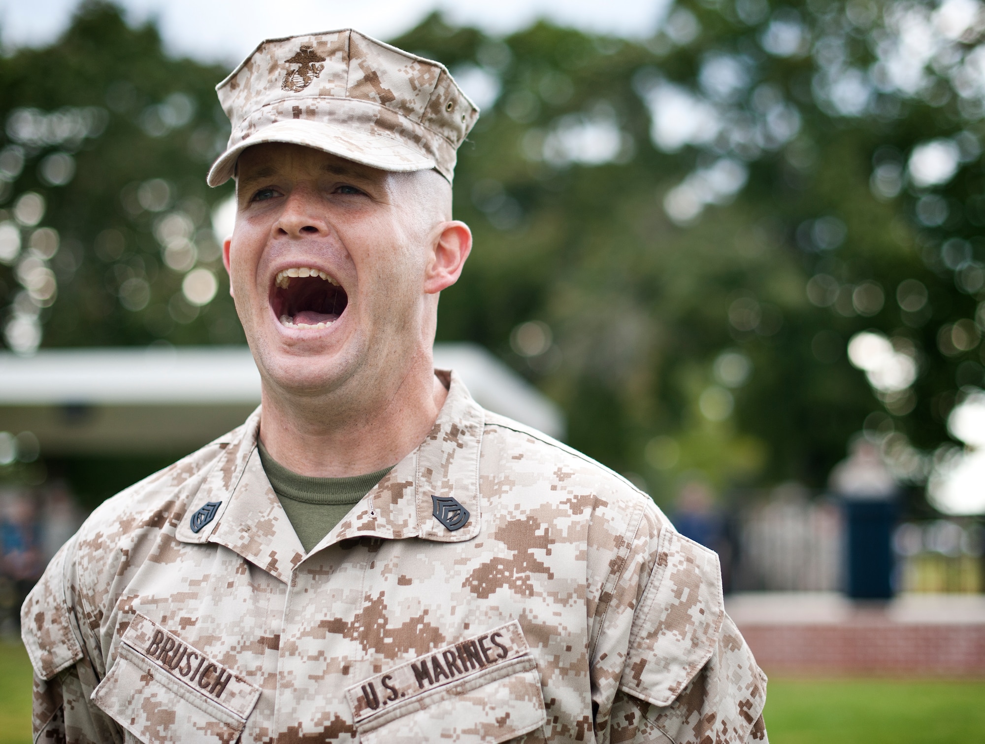 Marine Gunnery Sgt. Chris Brusich commands of troops during a retreat ceremony Sept. 26, 2013, on Sharpe Field at Joint Base McGuire-Dix-Lakehurst, N.J. (U.S. Air Force photo by Staff Sgt. Katherine Tereyama/Released)