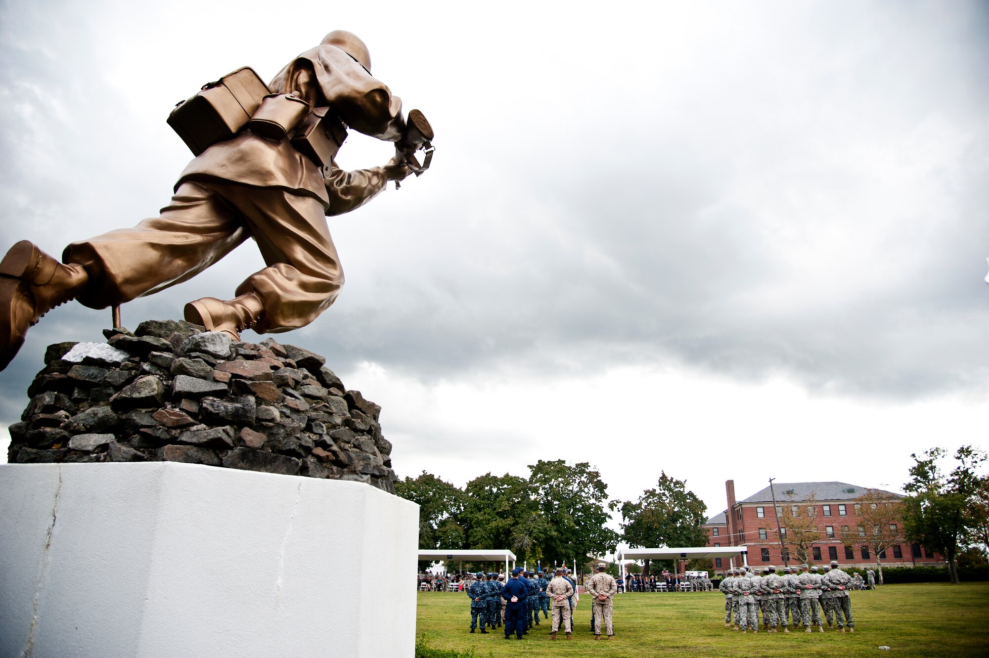 A statue entitled "The Ultimate Weapon" overlooks a retreat ceremony Sept. 26, 2013, on Sharpe Field at Joint Base McGuire-Dix-Lakehurst, N.J. (U.S. Air Force photo by Staff Sgt. Katherine Tereyama/Released)