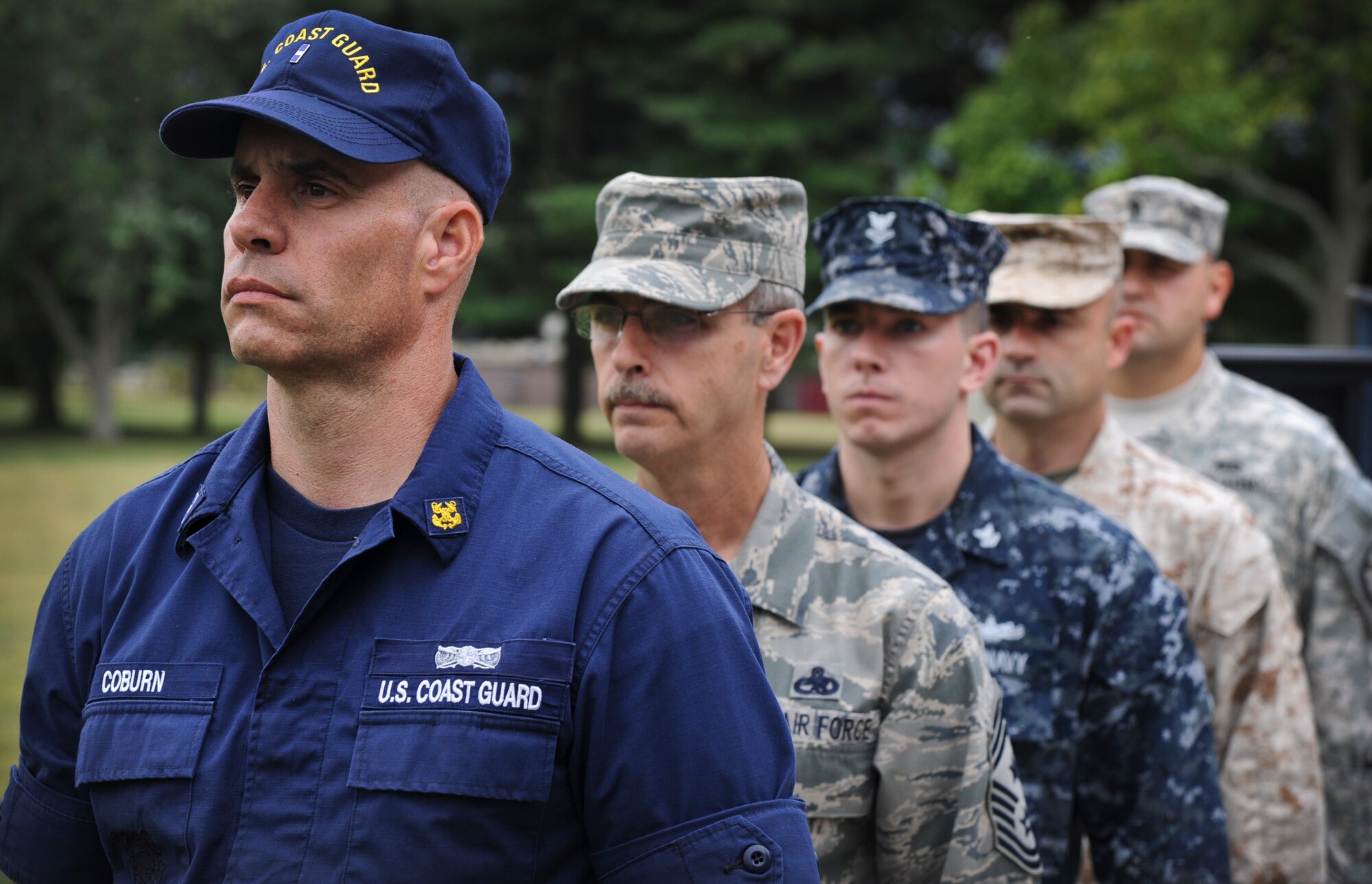 A Joint Base McGuire-Dix-Lakehurst color guard stands at attention for a formal retreat ceremony Sept. 26, 2013, on Sharpe Field at JB MDL, N.J. (U.S. Air Force photo by Airman 1st Class Sean Crowe/Released)