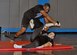 Staff Sgt. Chris Abernethy and Staff Sgt. Lawrence Alexander spar during their Kenpo promotion test for Purple Belt and Orange Belt at the 379th Air Expeditionary Wing in Southwest Asia, Sept. 29, 2013. Abernethy and Alexander trained with Maj. Douglas Pietersma, a Kenpo instructor and Black Belt holder, for the past few months to earn their promotions.  Abernethy is deployed from Joint Base Elmendorf-Richardson, Alaska, and Alexander is deployed from Yokota Air Base, Japan. (U.S. Air Force photo/1st Lt. Susan Harrington)