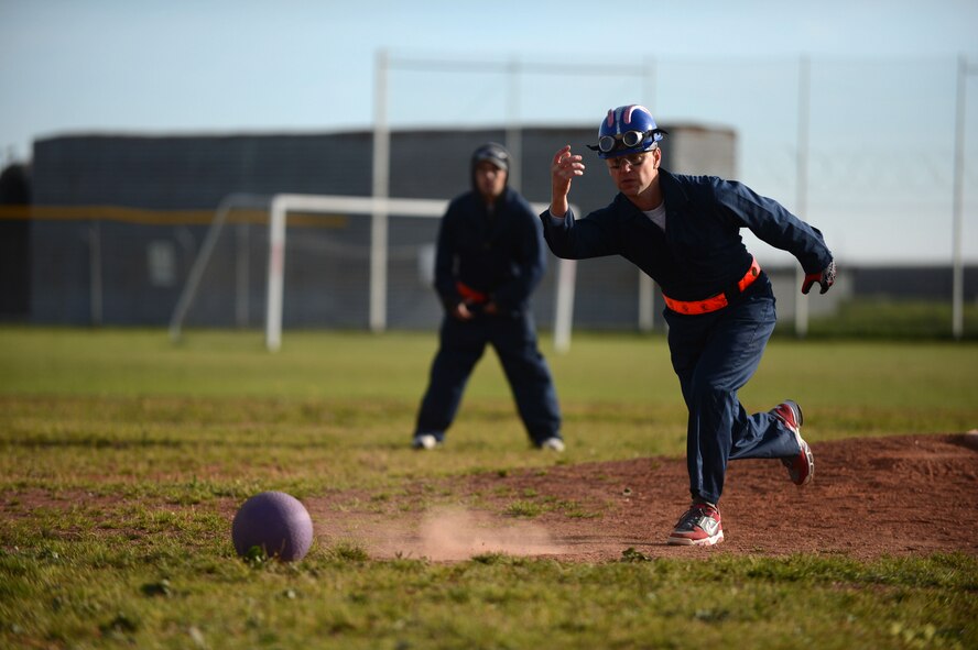 SPANGDAHLEM AIR BASE, Germany – U.S. Air Force Robert Tenny, 52nd Equipment Maintenance Squadron kickball pitcher, rolls a ball during Spangdahlem’s Sports Day Oct. 3, 2013. Throughout the day, members of the Spangdahlem community participated in six different sporting events. (U.S. Air Force photo Airman 1st Class Gustavo Castillo/Released)  