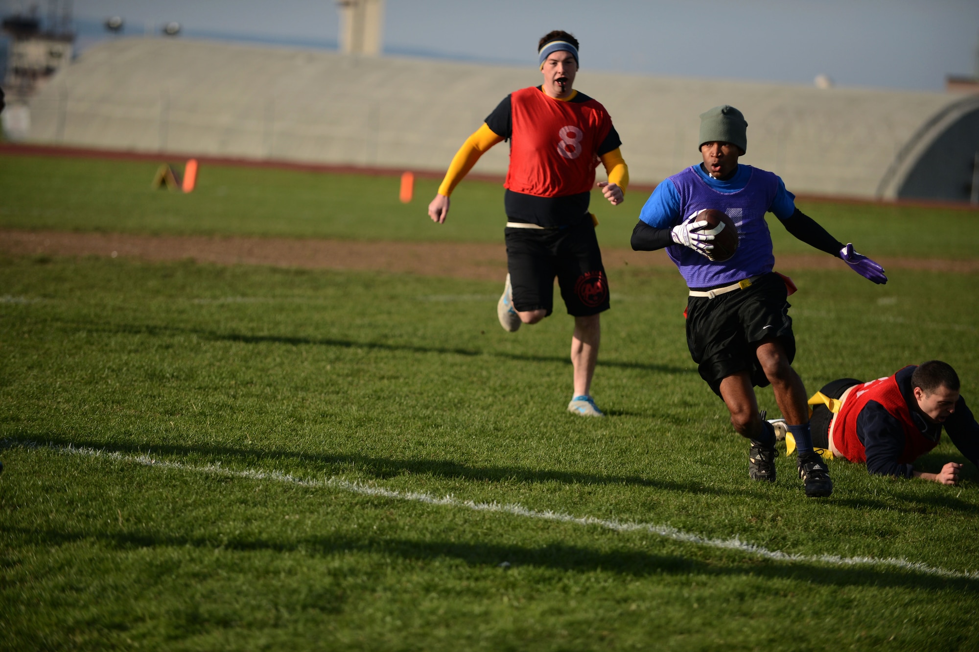 SPANGDAHLEM AIR BASE, Germany – U.S. Air Force Donnel Carney, 52nd Logistics Readiness Squadron quarterback, runs down the field during a football game for Spangdahlem’s Sports Day Oct. 3, 2013. Carney contributed two touch downs to his team, resulting in a victory of 19-6. (U.S. Air Force photo by Airman 1st Class Gustavo Castillo/Released)
