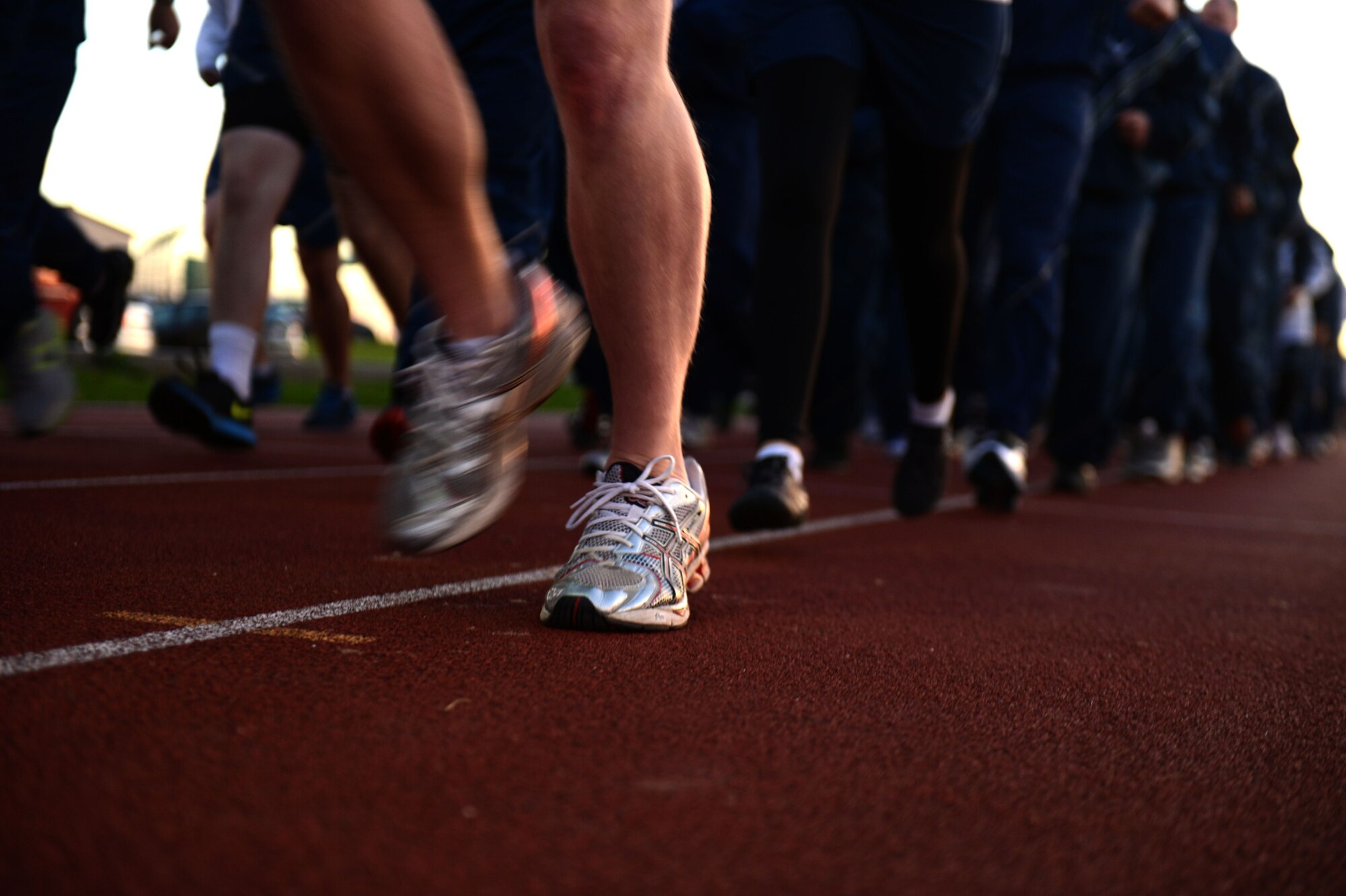 SPANGDAHLEM AIR BASE, Germany – Airmen participate in a jodie run at the track near the Skelton Memorial Fitness Center Oct. 3, 2013.  The run kicked off the Sports Day, which brought together Airmen from across the wing.(U.S. Air Force photo by Airman 1st Class Gustavo Castillo/Released) 