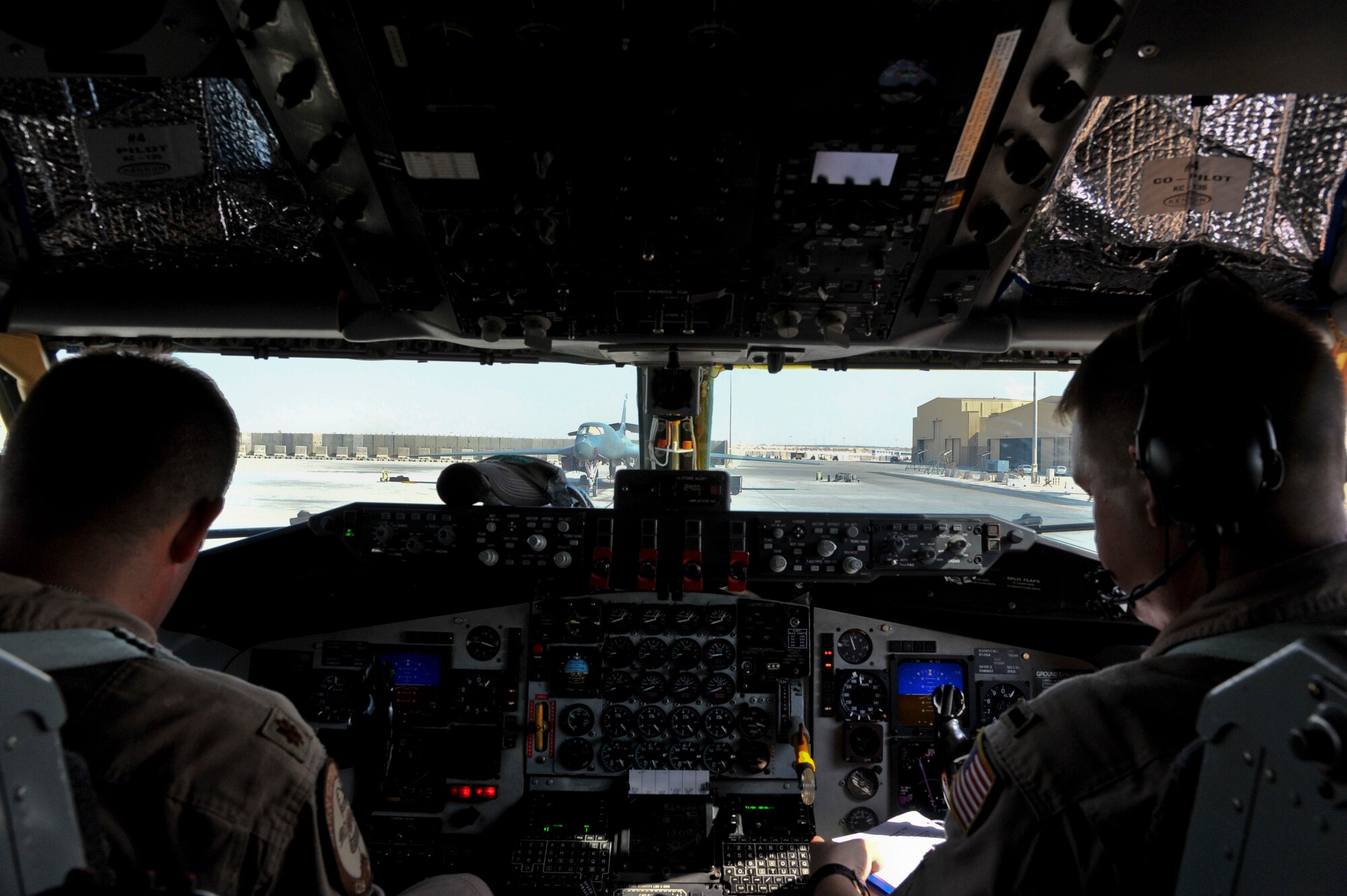 Maj. Jeremy Keyes and 1st Lt. Jacob Kummrow perform
pre-flight checks at the 379th Air Expeditionary Wing in Southwest Asia, Oct. 1, 2013. Both are deployed to the 340th Expeditionary Air Refueling Squadron, and from the 128th Air Refueling Wing (Wisconsin Air National Guard) in Milwaukee, Keyes hails from Big Bend, Wis., and Kummrow from Oconomowoc, Wis. (U.S. Air Force photo/Tech. Sgt. Joselito Aribuabo)
