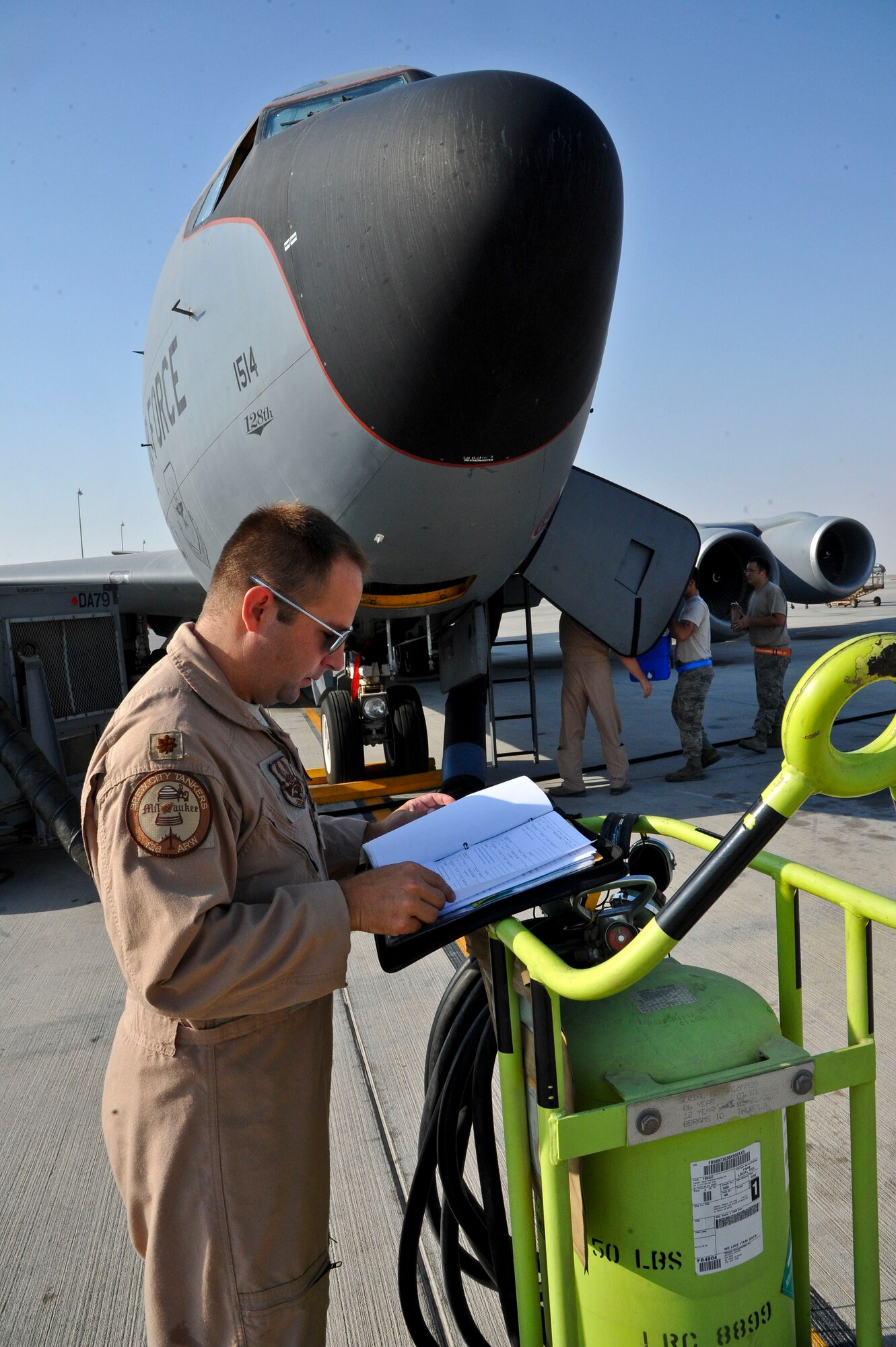 Maj. Jeremy Keyes reviews pre-flight inspection checklists at the 379th Air Expeditionary Wing in Southwest Asia, Oct. 1, 2013. Keyes is a 340th Expeditionary Air Refueling Squadron KC-135 aircraft commander deployed from the 128th Air Refueling Wing (Wisconsin Air National Guard) in Milwaukee, and hails from Big Bend, Wis. (U.S. Air Force photo/Tech. Sgt. Joselito Aribuabo)