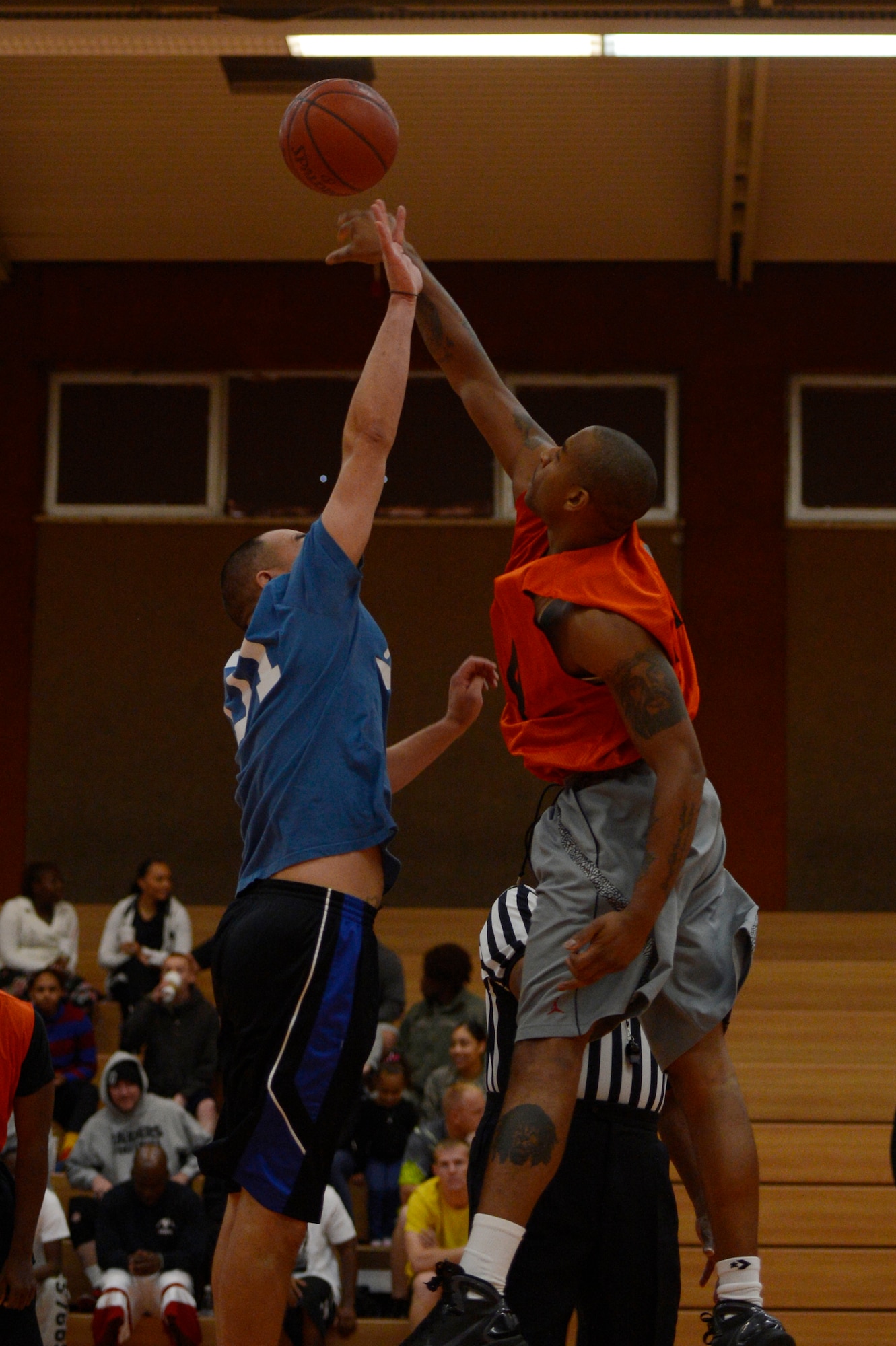 SPANGDAHLEM AIR BASE, Germany -- U.S. Air Force Master Sgt. Jaun Rivero, 52nd Component Maintenance Squadron assistant section chief, and U.S. Air Force Staff Sgt. Antwan Short, 52nd Equipment Maintenance Squadron security manager, vie for the opening tip during a basketball game while participating in Wing Sports Day, Oct. 3, 2013. The 52nd Logistics Readiness Squadron won first place in the basketball competition. (U.S. Air Force photo by Staff Sgt. Christopher Ruano/Released)