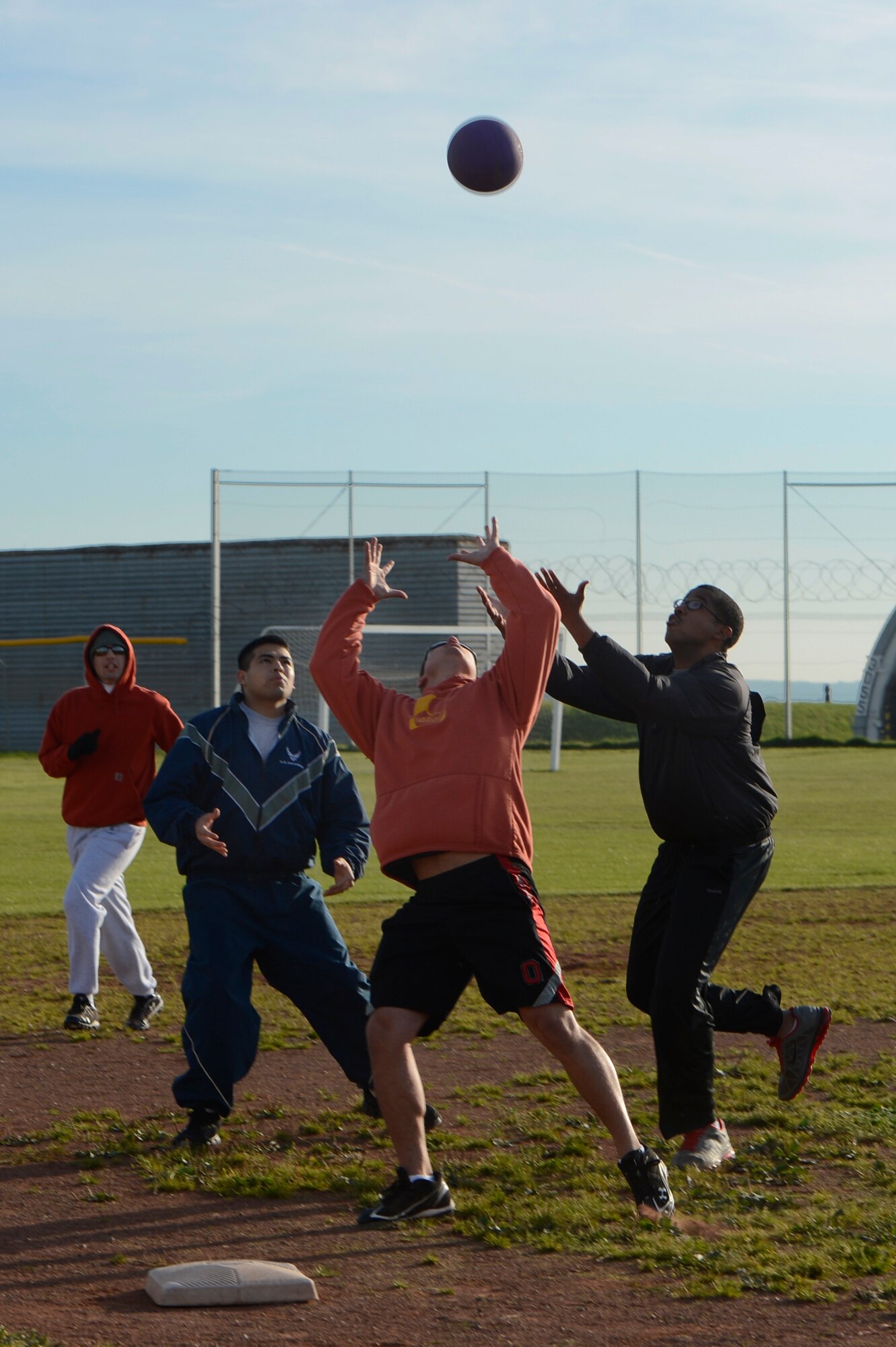 SPANGDAHLEM AIR BASE, Germany -- Members from the 52nd Civil Engineer Squadron run to catch a kickball during Wing Sports Day Oct. 3, 2013. Airmen came together for multiple sporting events to increase teamwork and camaraderie. (U.S. Air Force photo by Staff Sgt. Christopher Ruano/Released)