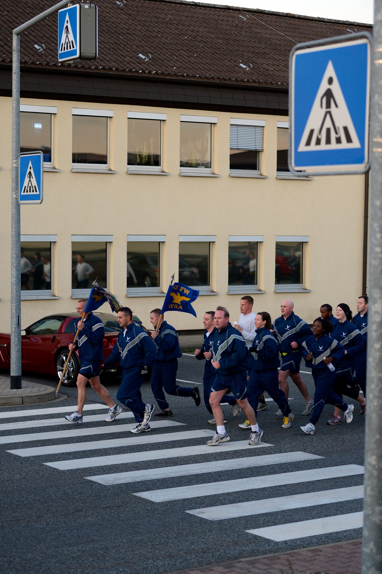 SPANGDAHLEM AIR BASE, Germany -- Base members help kick off Wing Sports Day with a jodie run Oct. 3, 2013.  Airmen participated in a variety of activities, such as track and field, flag football, wallyball, kickball, bowling, and basketball. These events were followed by the wing leadership obstacle course competition. (U.S. Air Force photo by Staff Sgt. Christopher Ruano/Released)