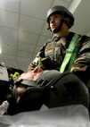 Senior Airman David Tierney, 8th Medical Operations Squadron, focuses while applying pressure to an injured patient’s wounds during exercise Beverly Midnight 13-4 at Kunsan Air Base, Republic of Korea, Oct. 3, 2013. Exercises ensure the Wolf Pack medical staff is always prepared to respond in any situation. (U.S. Air Force photo by Staff Sgt. Jessica Haas/Released)