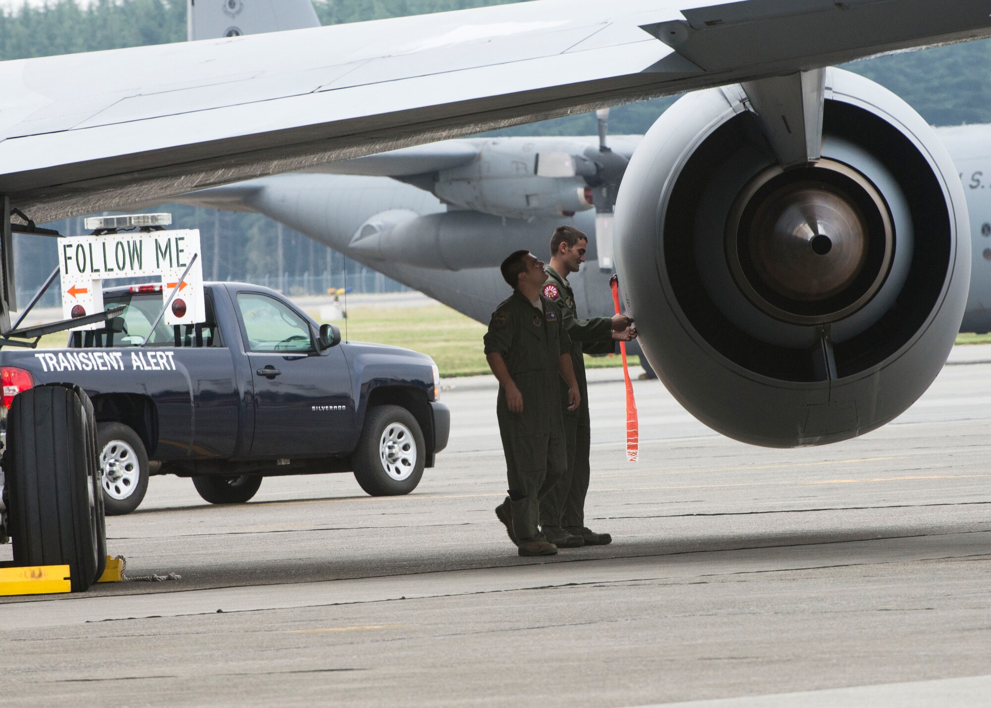 U.S. Air Force loadmasters inspect a KC-135 Stratotanker after landing at Yokota Air Base, Japan, Oct. 4, 2013. Eighteen aircraft from Kadena Air Base and Marine Corps Air Station Futenma diverted to Yokota due to the inbound typhoon. (U.S. Air Force photo by Airman 1st Class Meagan Schutter)