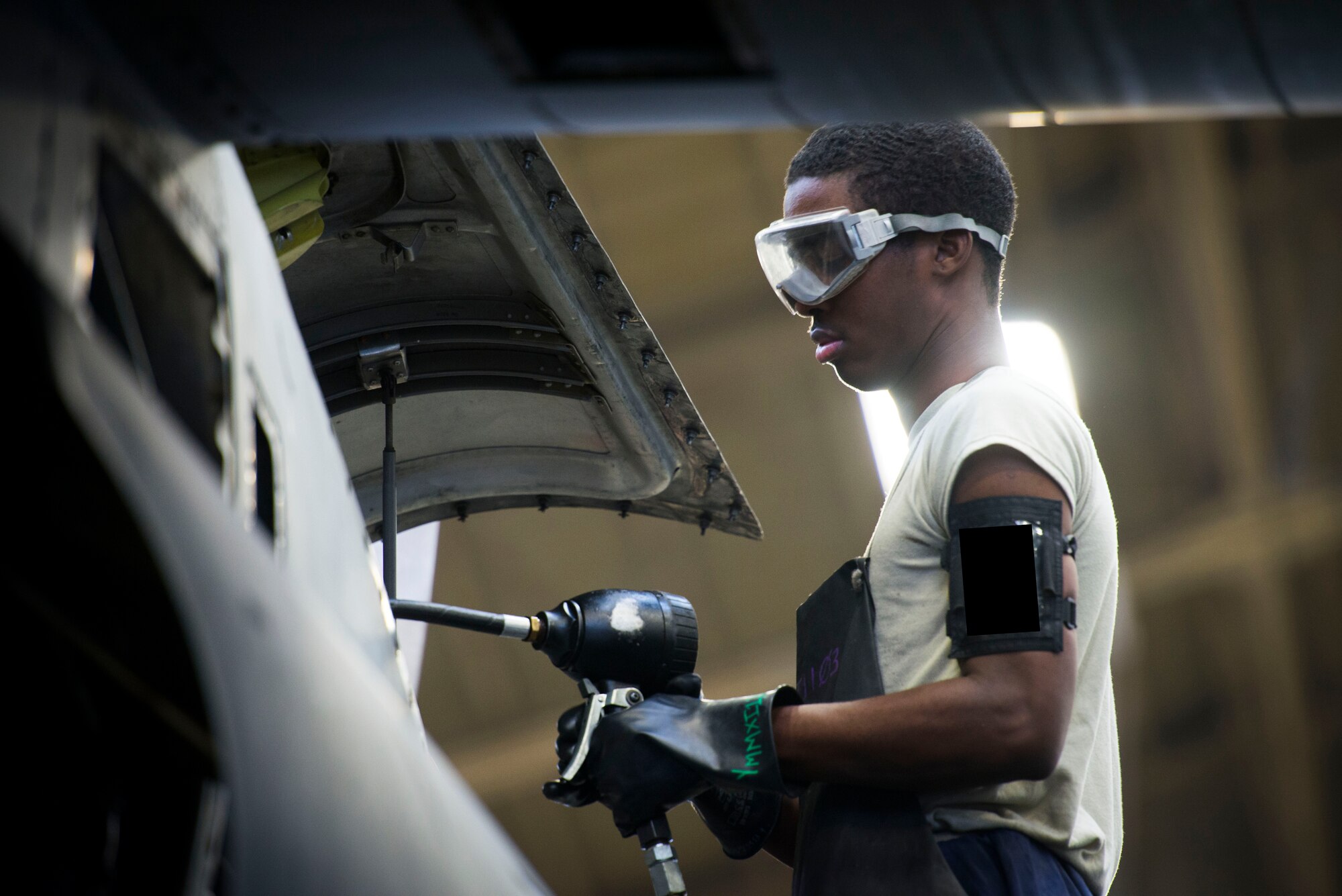 Airman 1st Class Amari Palmer, 374th Maintenance Squadron Aerospace technician, conducts an isochronal inspection on a C-130 Hercules Oct. 4, 2013, at Yokota Air Base, Japan. (U.S. Air Force photo by Staff Sgt. Chad C. Strohmeyer/released)