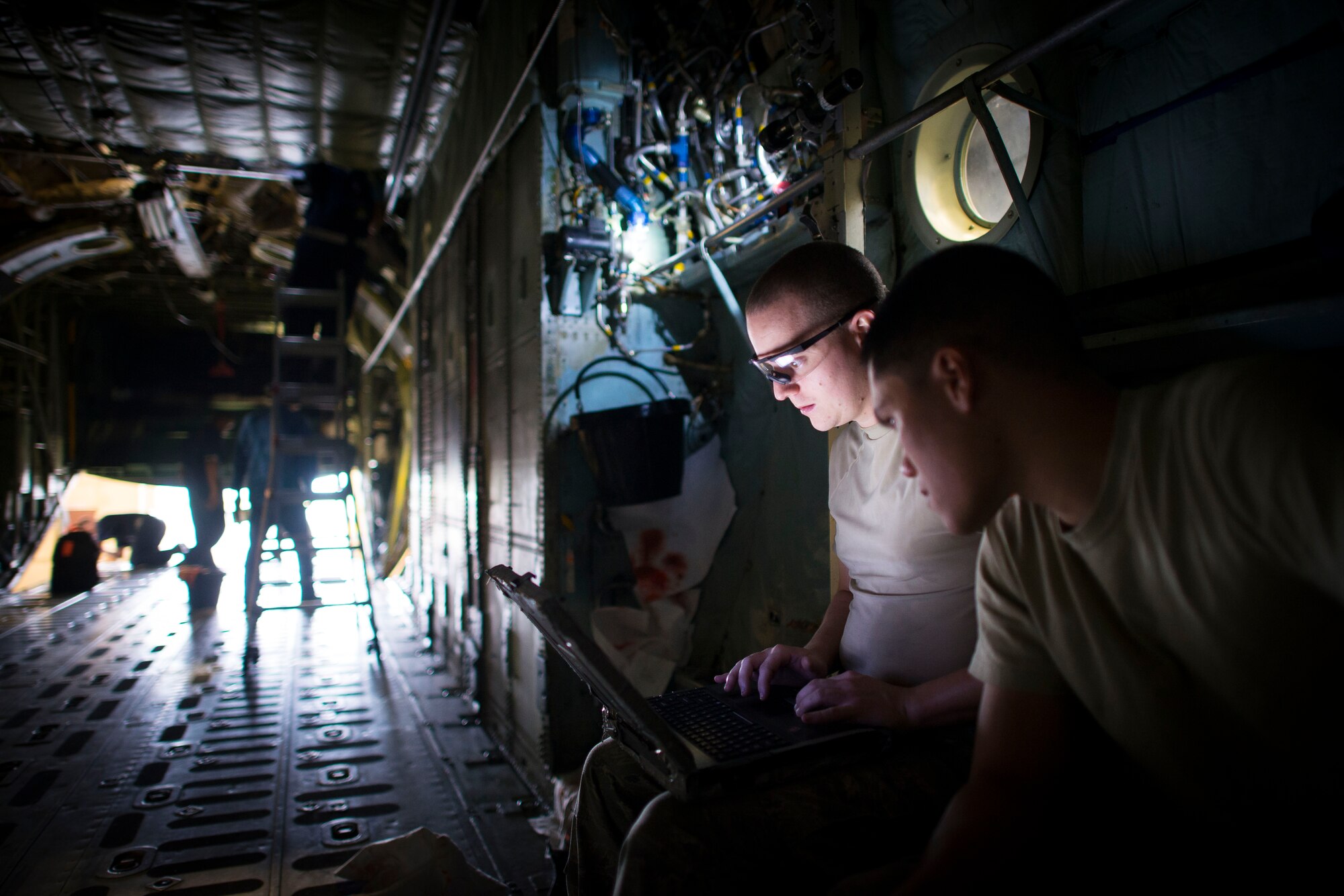 374th Maintenance Squadron Airmen conduct an isochronal inspection on a C-130 Hercules Oct. 4, 2013, at Yokota Air Base, Japan. Conducted once every 540 days, the inspection ensures aircraft safety and longevity. (U.S. Air Force photo by Staff Sgt. Chad C. Strohmeyer/released)