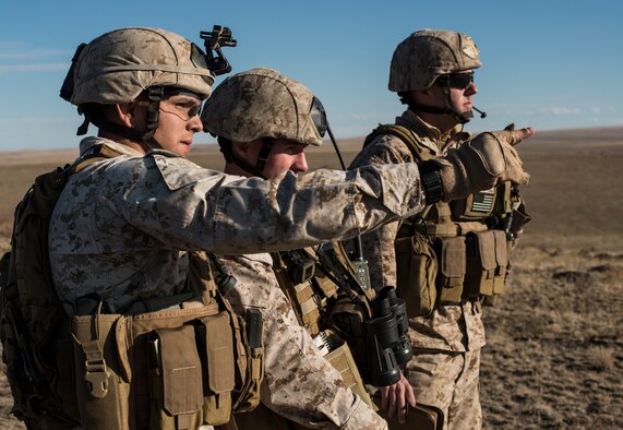 U.S. Marine Corps joint terminal attack controllers work a close-air support mission from a Sailor Creek Range observation post during exercise Mountain Roundup 2013 at Mountain Home Air Force Base, Idaho, Oct. 2, 2013. Marine Capt. Chris Walker, 1st ANGLICO movement team leader, led a four-man Marine joint terminal attack controller team, augmenting both German and U.S. Air Force JTACs. (U.S. Air Force photo by Master Sgt. Kevin Wallace/RELEASED)