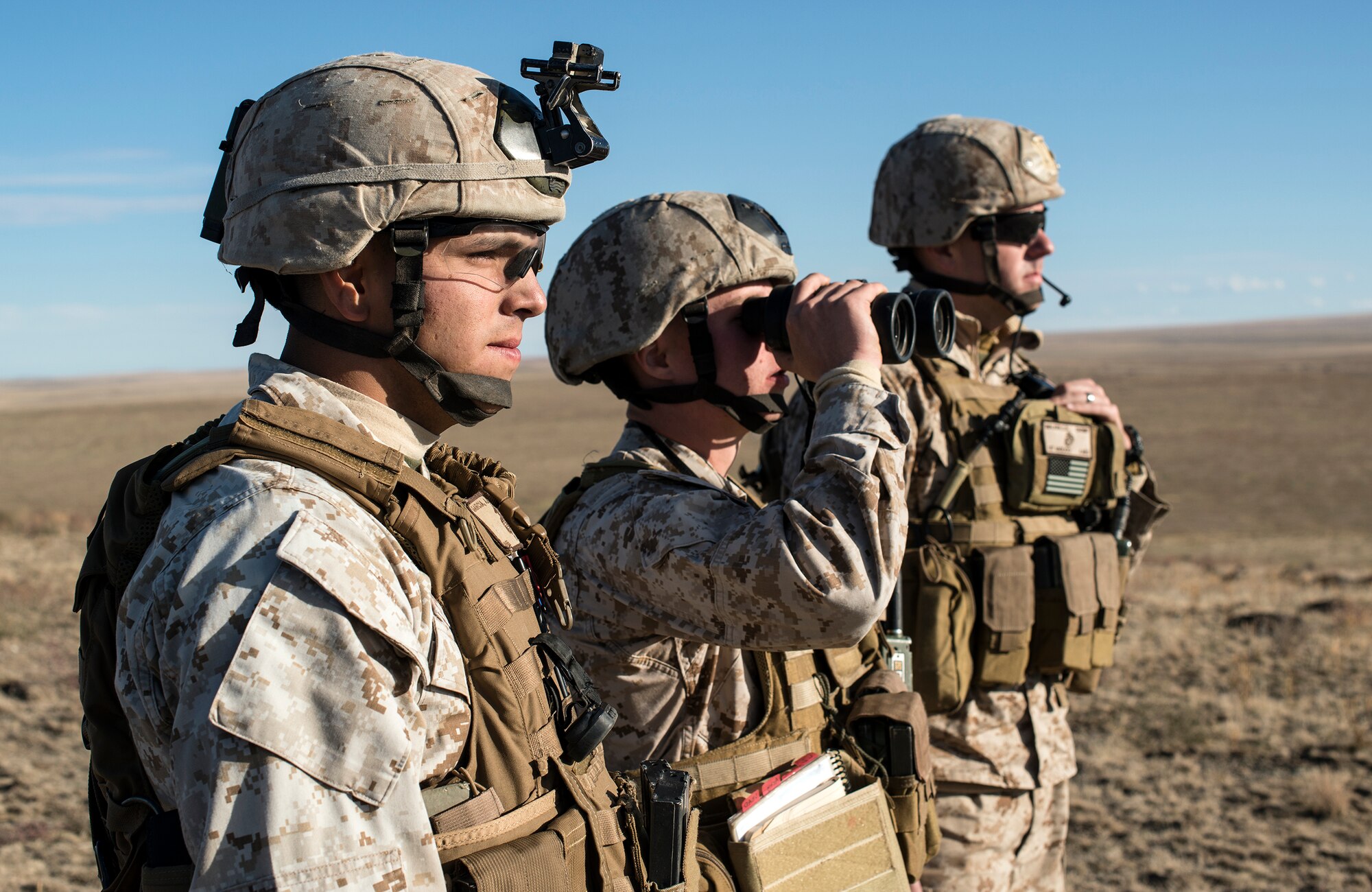 U.S. Marine Corps joint terminal attack controllers work a close-air support mission from a Sailor Creek Range observation post during exercise Mountain Roundup 2013 at Mountain Home Air Force Base, Idaho, Oct. 2, 2013. Marine Capt. Chris Walker, 1st ANGLICO movement team leader, led a four-man Marine joint terminal attack controller team, augmenting both German and U.S. Air Force JTACs. (U.S. Air Force photo by Master Sgt. Kevin Wallace/RELEASED)