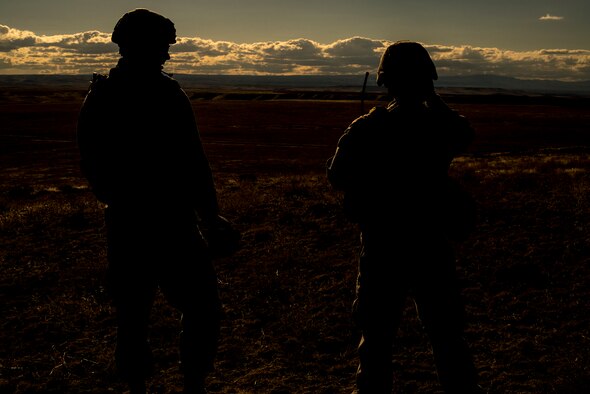 U.S. Marine Corps joint terminal attack controllers work a close-air support mission from a Sailor Creek Range observation post during exercise Mountain Roundup 2013 at Mountain Home Air Force Base, Idaho, Oct. 2, 2013. The Marines deployed from the 1st Air Naval Gunfire Liaison Company. (U.S. Air Force photo by Master Sgt. Kevin Wallace/RELEASED)
