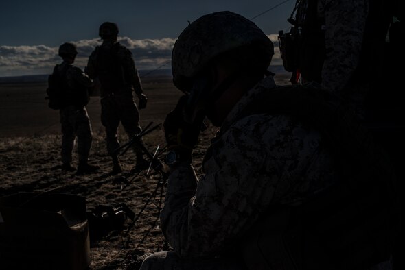U.S. Marine Corps joint terminal attack controllers work a close-air support mission from a Sailor Creek Range observation post during exercise Mountain Roundup 2013 at Mountain Home Air Force Base, Idaho, Oct. 2, 2013. The Marines deployed from the 1st Air Naval Gunfire Liaison Company. (U.S. Air Force photo by Master Sgt. Kevin Wallace/RELEASED)