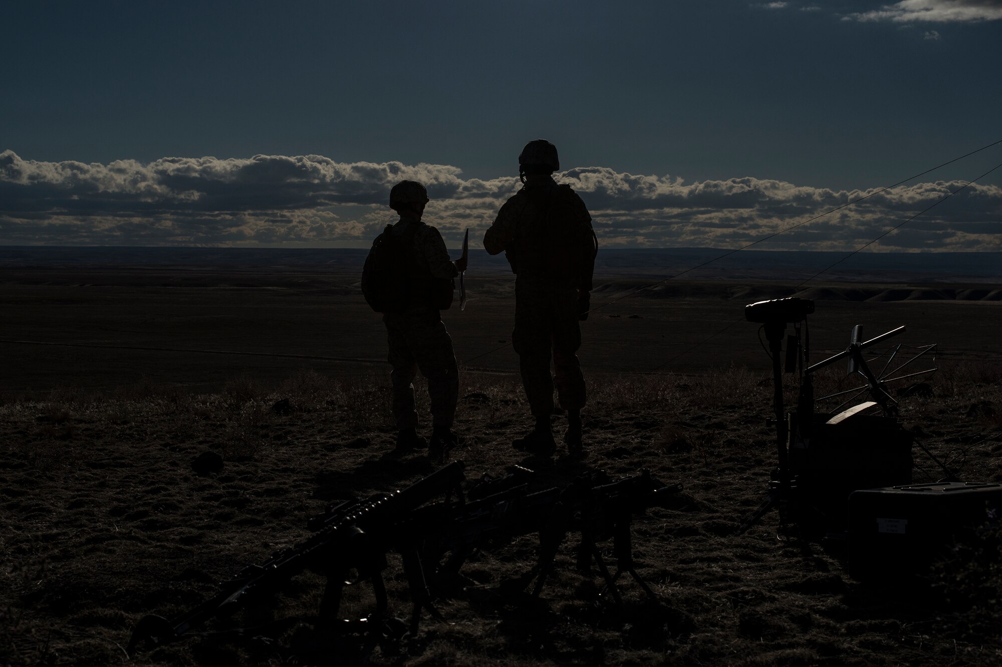 U.S. Marine Corps joint terminal attack controllers work a close-air support mission from a Sailor Creek Range observation post during exercise Mountain Roundup 2013 at Mountain Home Air Force Base, Idaho, Oct. 2, 2013. The Marines deployed from the 1st Air Naval Gunfire Liaison Company. (U.S. Air Force photo by Master Sgt. Kevin Wallace/RELEASED)