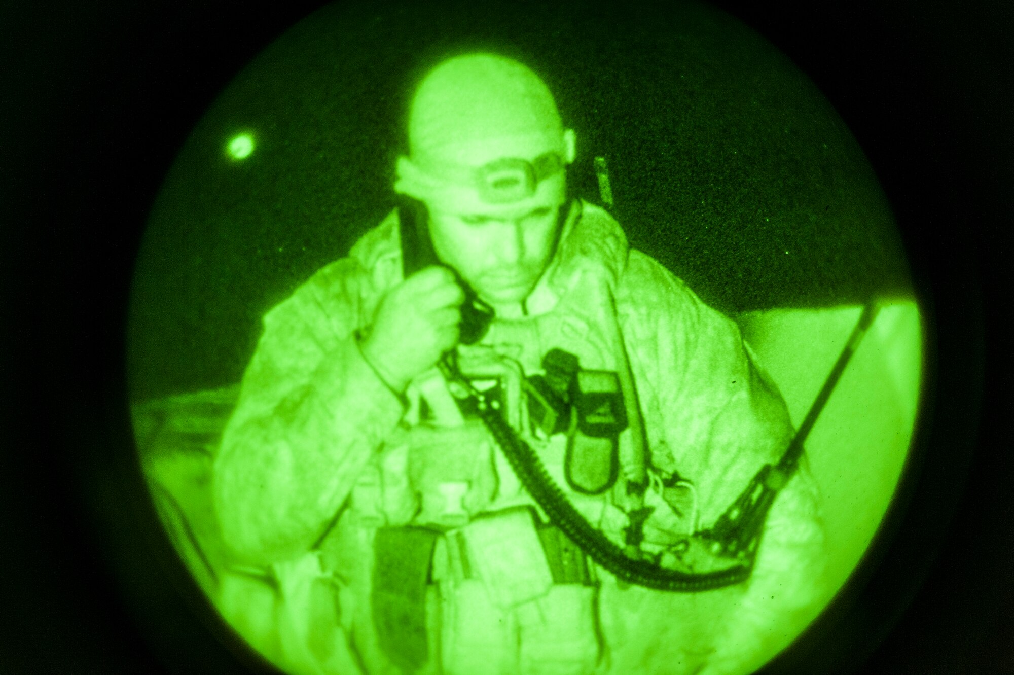 U.S. Marine Capt. Erich Lloyd, 1st Air Naval Gunfire Liaison Company joint terminal attack controller, works a close-air support late night mission during exercise Mountain Roundup 2013 at Mountain Home Air Force Base, Idaho, Oct. 2, 2013. The ANGLICO Marines are scheduled to deploy later next year. (U.S. Air Force photo by Master Sgt. Kevin Wallace/RELEASED)