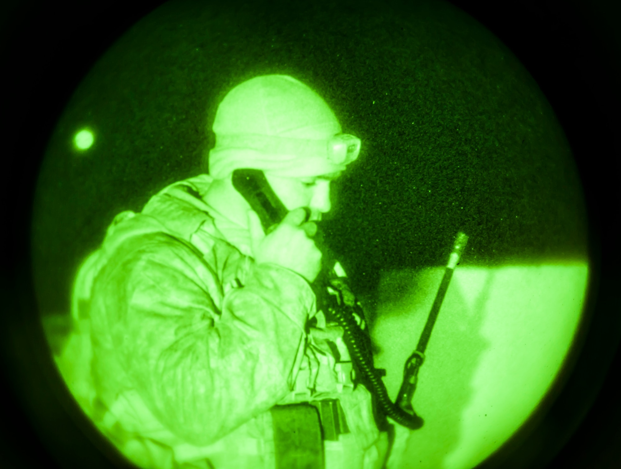 U.S. Marine Capt. Erich Lloyd, 1st Air Naval Gunfire Liaison Company joint terminal attack controller, works a close-air support late night mission during exercise Mountain Roundup 2013 at Mountain Home Air Force Base, Idaho, Oct. 2, 2013. The ANGLICO Marines are scheduled to deploy later next year. (U.S. Air Force photo by Master Sgt. Kevin Wallace/RELEASED)