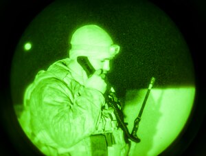 U.S. Marine Capt. Erich Lloyd, 1st Air Naval Gunfire Liaison Company joint terminal attack controller, works a close-air support late night mission during exercise Mountain Roundup 2013 at Mountain Home Air Force Base, Idaho, Oct. 2, 2013. The ANGLICO Marines are scheduled to deploy later next year. (U.S. Air Force photo by Master Sgt. Kevin Wallace/RELEASED)