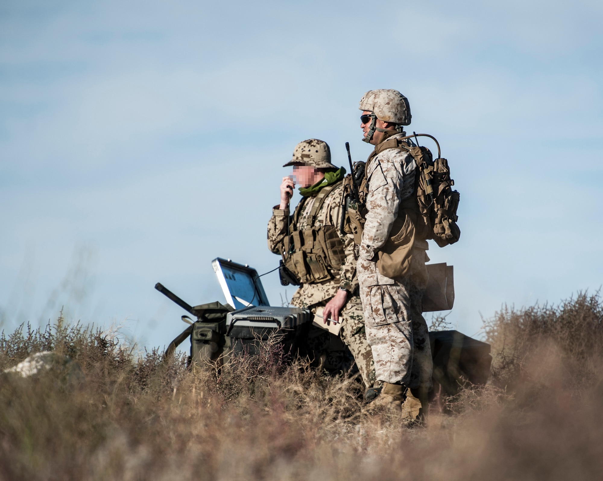 U.S. Marine Capt. Erich Lloyd, 1st Air Naval Gunfire Liaison Company joint terminal attack controller, and a German Air Force JTAC (identity withheld), work a close-air support mission during exercise Mountain Roundup 2013 at Mountain Home Air Force Base, Idaho, Oct. 2, 2013. The ANGLICO Marines are scheduled to deploy later next year. (U.S. Air Force photo by Master Sgt. Kevin Wallace/RELEASED)