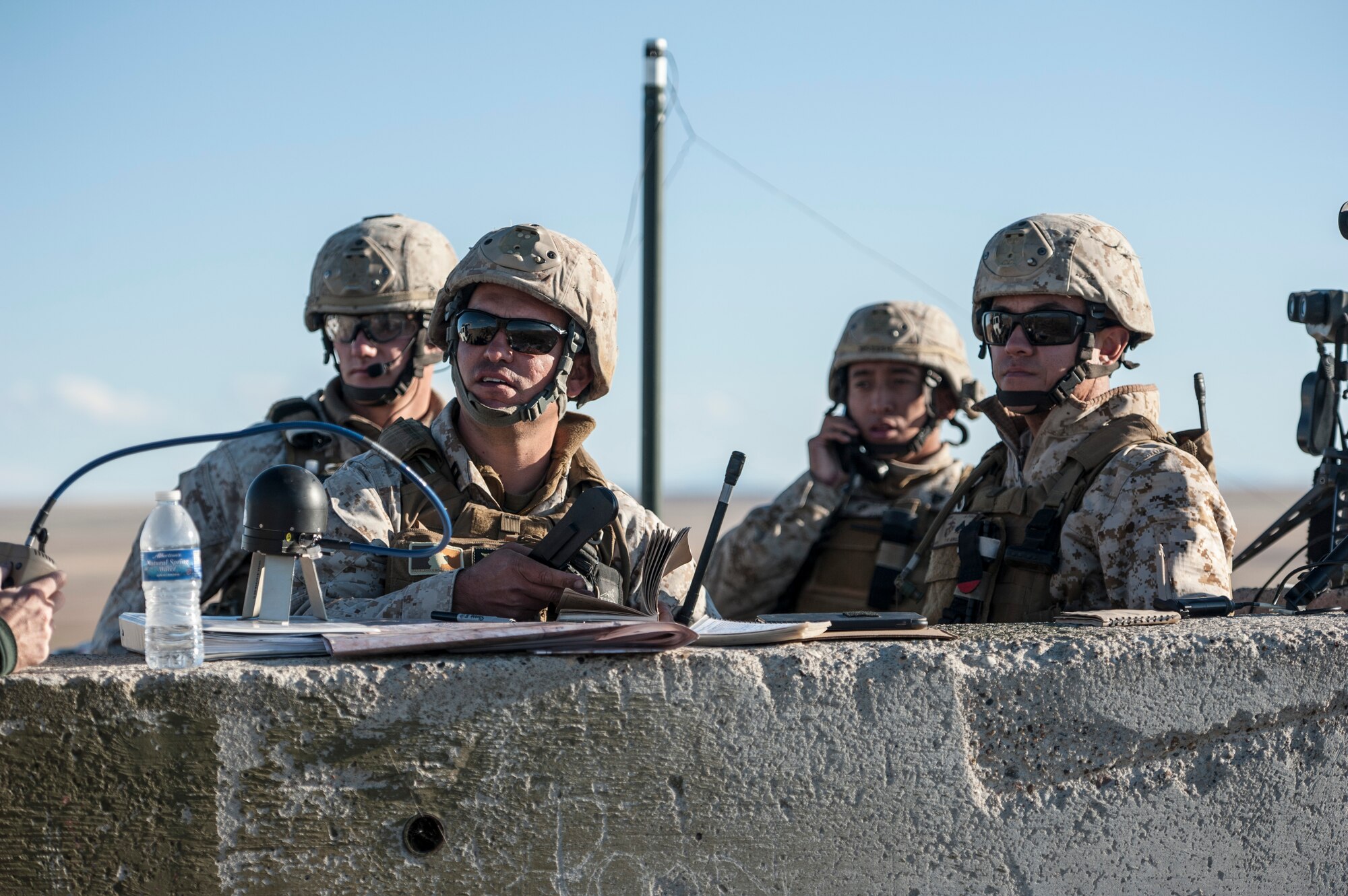 U.S. Marine Corps joint terminal attack controllers work a close-air support mission from a Sailor Creek Range observation post during exercise Mountain Roundup 2013 at Mountain Home Air Force Base, Idaho, Oct. 2, 2013. The Marines deployed from the 1st Air Naval Gunfire Liaison Company. (U.S. Air Force photo by Master Sgt. Kevin Wallace/RELEASED)