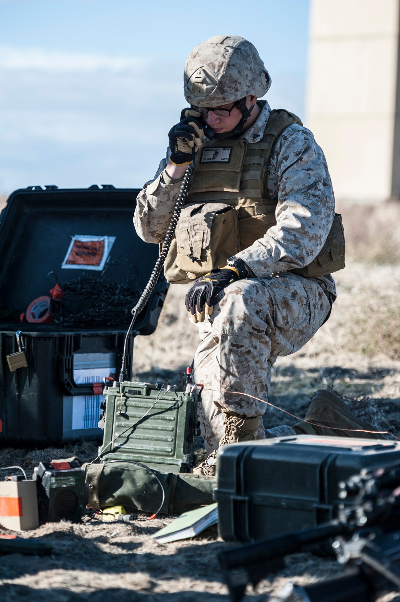 U.S. Marine Lance Cpl. Salome Sanchez, 1st Air Naval Gunfire Liaison Company radio operator, works a close-air support mission during exercise Mountain Roundup 2013 at Mountain Home Air Force Base, Idaho, Oct. 2, 2013. Aside from communicating with aviators, the ANGLICO teams can integrate both ground and naval surface fires to support the ground commander's scheme of maneuver. (U.S. Air Force photo by Master Sgt. Kevin Wallace/RELEASED)