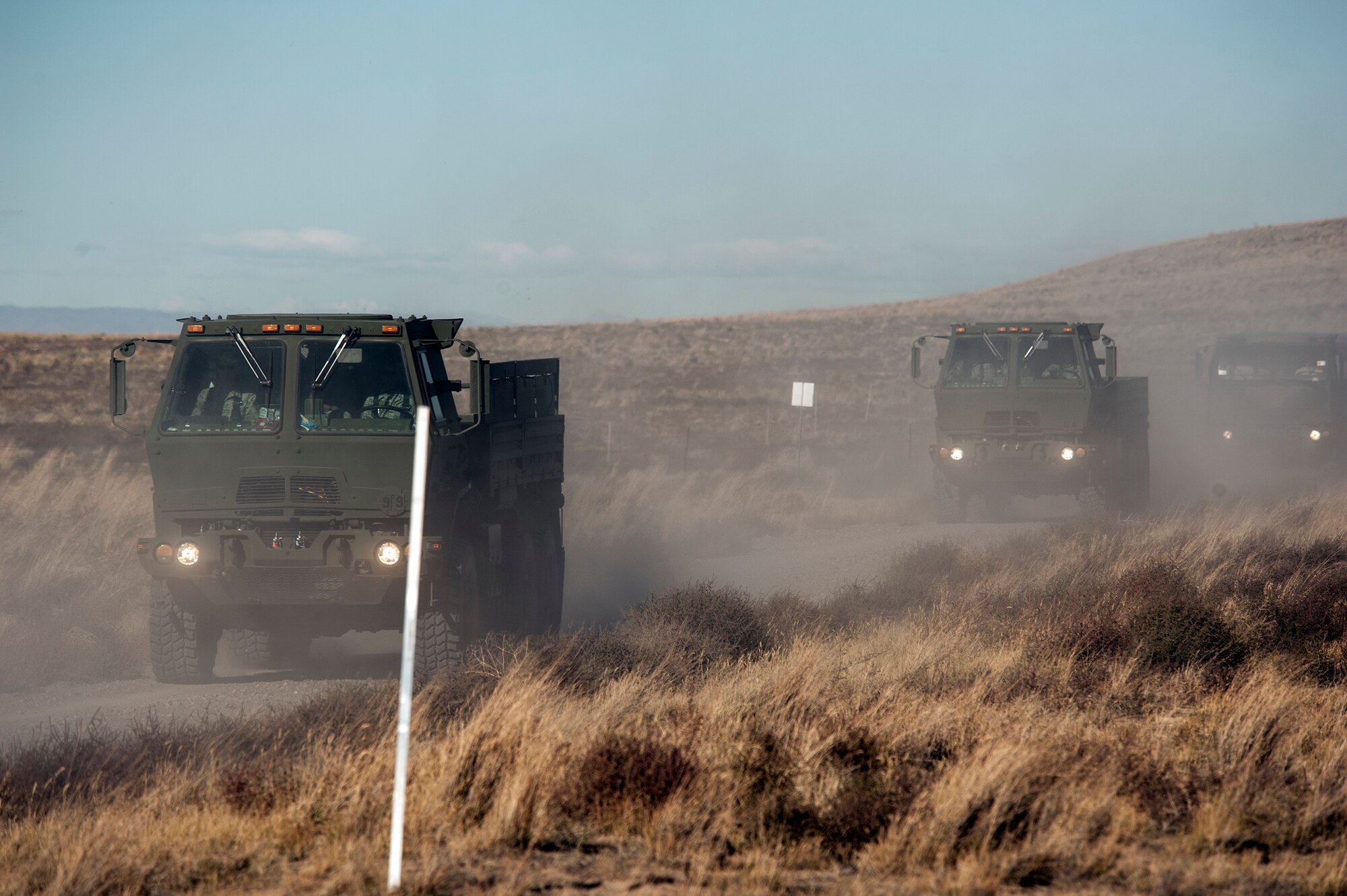 A 726th Air Control Squadron convoy moves across the Idaho desert, roughly 75 miles from Mountain Home Air Force Base, Oct. 4, 2013. The 726th ACS convoy served as a training “enemy” force for U.S. Navy AV8-B Harriers, German Air Force AG-51 Tornados and for a team of U.S. Marine 1st Air Naval Gunfire Liaison Company joint terminal attack controllers, providing mutual beneficial training for all parties. "As a SALT, we are excited to be working hand-in-hand with our German counterparts during the exercise, meet our goals of increasing individual and team proficiencies in regards to CAS and also to develop our unit as fire-support coordination experts," said Marine Capt. Charles Watt, 1st ANGLICO Supporting Arms Liaison Team (or, SALT) officer-in-charge. "In short, we enable foreign militaries to capitalize on fire support provided by the U.S. military by embedding fire support experts within their ranks." (U.S. Air Force photo by Senior Airman Benjamin Sutton/RELEASED)