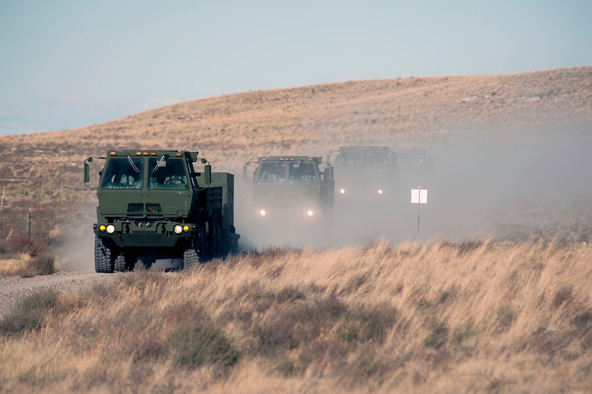 A 726th Air Control Squadron convoy moves across the Idaho desert, roughly 75 miles from Mountain Home Air Force Base, Oct. 4, 2013. The 726th ACS convoy served as a training “enemy” force for U.S. Navy AV8-B Harriers, German Air Force AG-51 Tornados and for a team of U.S. Marine 1st Air Naval Gunfire Liaison Company joint terminal attack controllers, providing mutual beneficial training for all parties. The 1st ANGLICO team members called in air support during the exercise to re-qualify JTACs and to maintain proficiency in their ability to provide close-air support, while training with another major coalition partner nation - Germany. (U.S. Air Force photo by Senior Airman Benjamin Sutton/RELEASED)