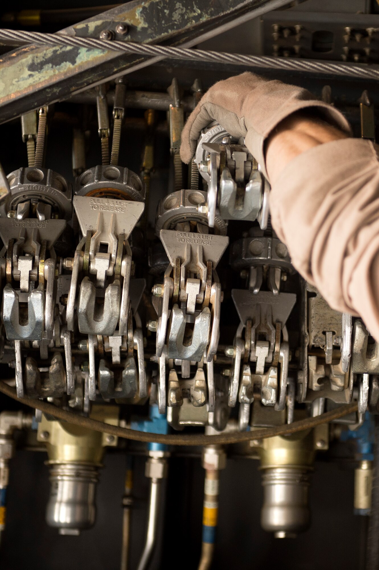 Senior Airman Zac Sidders, 774th Expeditionary Airlift Squadron C-130 Hercules loadmaster, grabs tie down chain devices to for a 10,000 pound forklift at Forward Operating Base Sharana, Paktika Province, Afghanistan, Sept. 28, 2013. This mission marked a retrograde milestone as the 774th EAS transported the last cargo from FOB Sharana before the base is transferred to the Afghan Ministry of Defense. Sidders, a Peoria, Ill., native, is deployed from the Wyoming Air National Guard.
(USAF Photo/Master Sgt. Ben Bloker)
