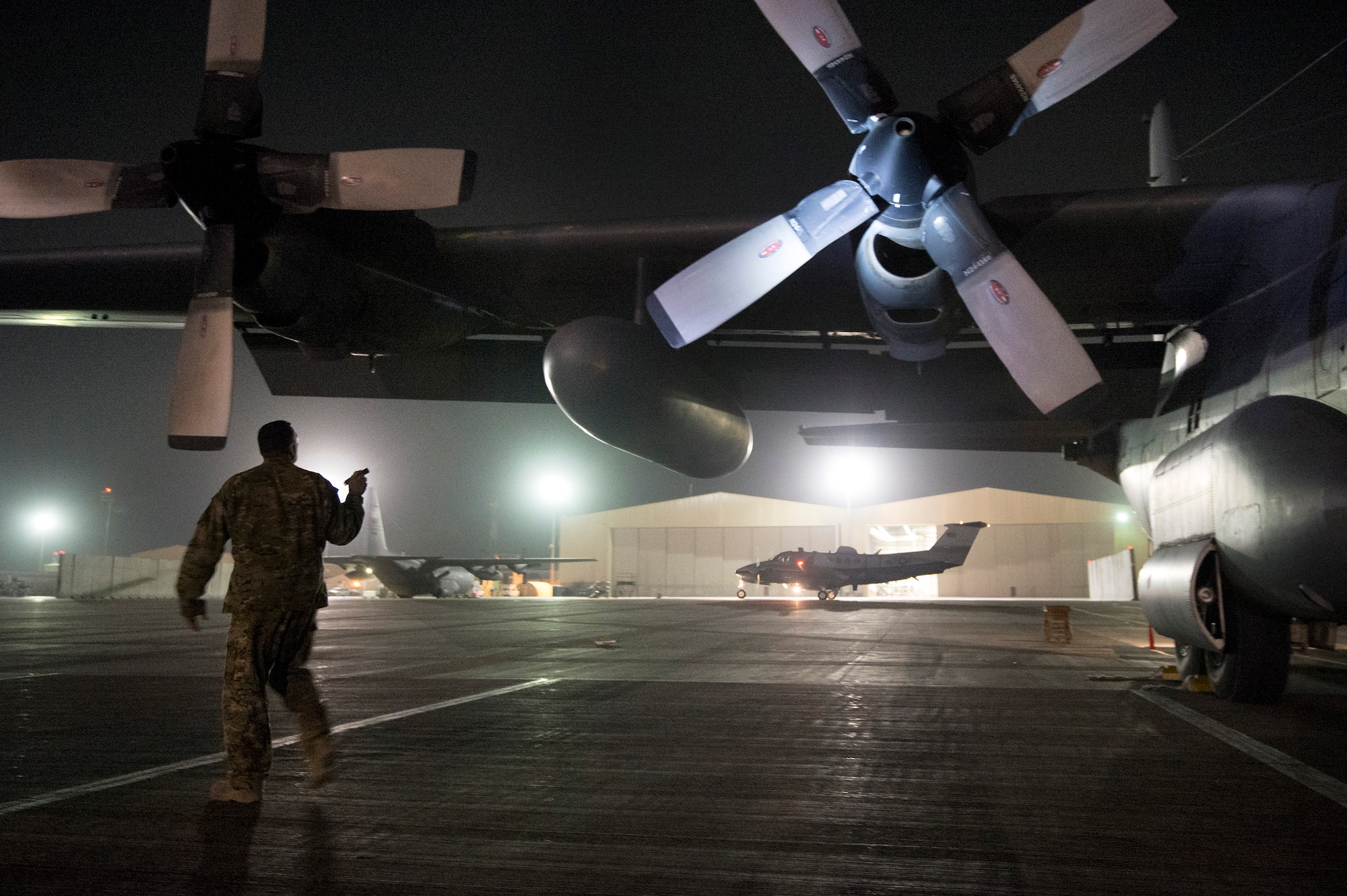 Staff Sgt. David Billings, 774th Expeditionary Airlift Squadron flight engineer, preflights a C-130 Hercules cargo plane before a mission out of Bagram Air Field, Afghanistan, Sept. 28, 2013. This mission marked a retrograde milestone as the 774th EAS transported the last cargo from Forward Operating Base Sharana, Paktika province, Afghanistan, before the base is transferred to the Afghan Ministry of Defense. Billings, a Cabot, Ark., native, is deployed from the Little Rock, Arkansas Air National Guard.
(USAF Photo/Master Sgt. Ben Bloker)
