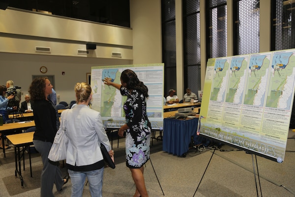 Murika Davis (right), CEPP engineering lead, and Gretchen Ehlinger (left), CEPP environmental lead, discuss the project’s Tentatively Selected Plan with meeting attendants during the open house portion of the Sept. 17 meeting in Fort Myers, Fla. (