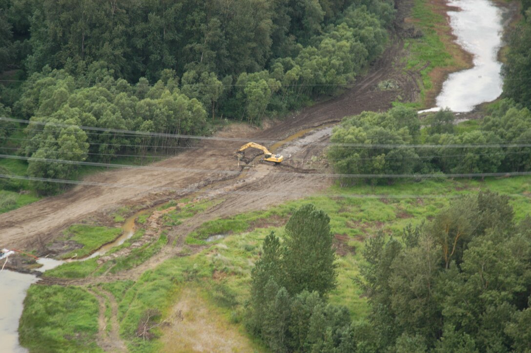 U.S. Army Corps of Engineers contractors re-open an historic channel of the Sandy River near Portland, Ore., as part of a habitat restoration project. The multi-agency partnership will allow the Sandy River to create its own path to the Columbia River, creating habitat for young fish. Partners include BPA, Portland Water Bureau and the U.S. Forest Service.