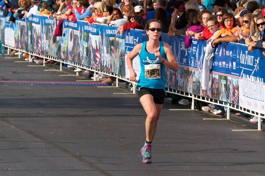 Maj. Elissa Ballas, 8th Medical Operations Squadron physical therapy and health and wellness center flights commander, runs in the Air Force Half Marathon at Wright-Patterson Air Force Base, Ohio, Sept. 15, 2012. The half marathon was just one of many races Ballas completed, including the Busan Beach ultra-marathon, where she came in 3rd overall out of 1,300 competitors. (Courtesy Photo/Joe Fanning)