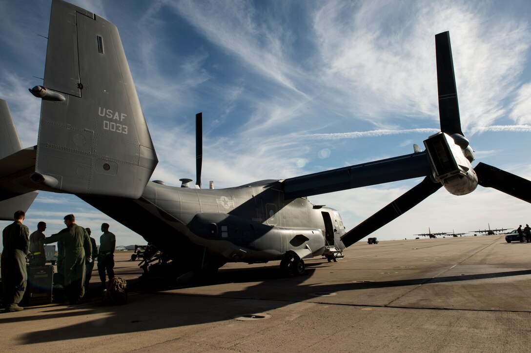 CV-22 Air crews from Hurlburt Field, Fla., secure their aircraft at Cannon Air Force base, N.M. Oct. 3. Air frames from the 1st Special Operations wing were relocated to Cannon in an effort to protect government assets in the wake of Tropical Storm Karen. (U.S. Air Force photo/ Staff Sgt. Matthew Plew)