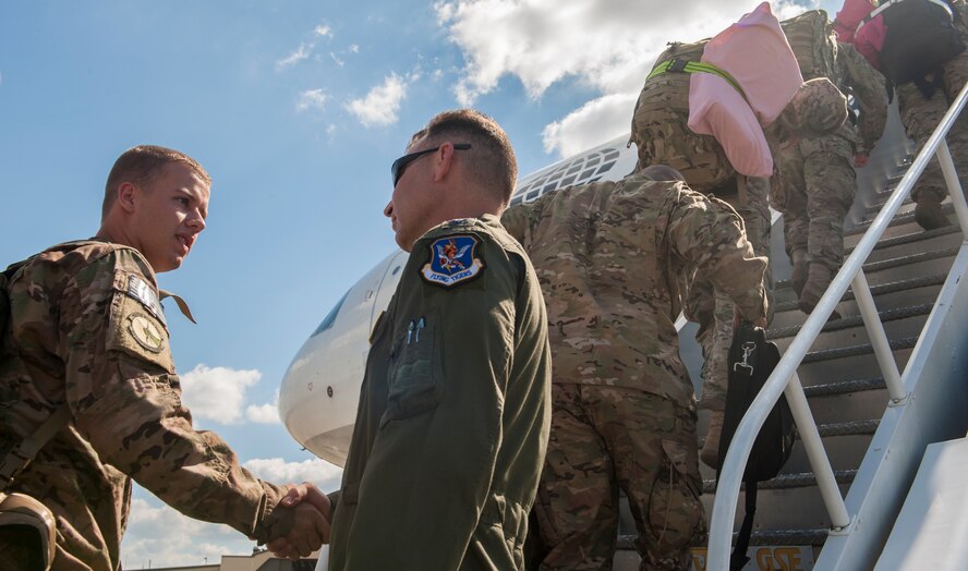 U.S. Air Force Col. Chad Franks, 23d Wing commander, shakes hands with Airmen deploying from Moody Air Force Base, Ga., Sept. 27, 2013. Franks thanked the Airmen and told them to stay safe. (U.S. Air Force photo by Airman Alexis Grotz/Released)