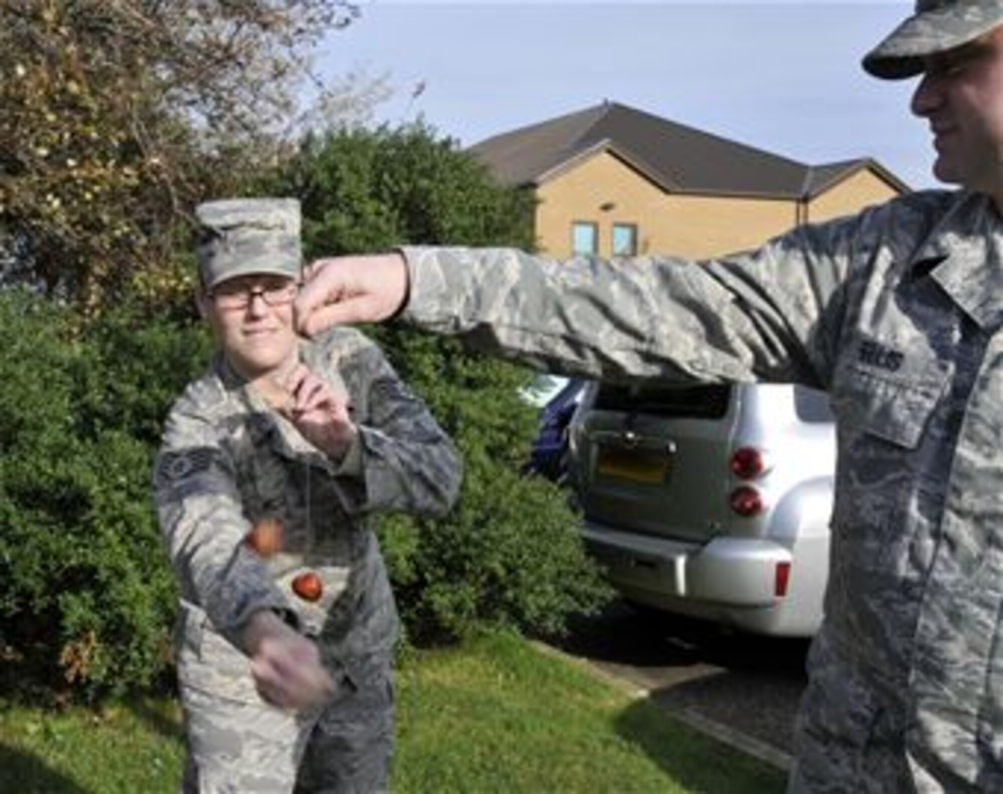 Staff Sgt Felicia Welch and Senior Airman Brian Ellis engage in a game of conkers. The game is played between two players taking turns striking their opponent’s conker with their own. The intent is to hit the opponent’s conker as hard as possible, inflicting damage on your opponent.The first recorded game of conkers dates back to 1848 on the Isle of Wight. Conkers are hard brown nuts found in a prickly case that fall from the tree when ripe. The origin of the name 'conker' is unclear but it's believed that it comes from the French word 'cogner' meaning to hit. ( Photo by A1C Perry Aston)