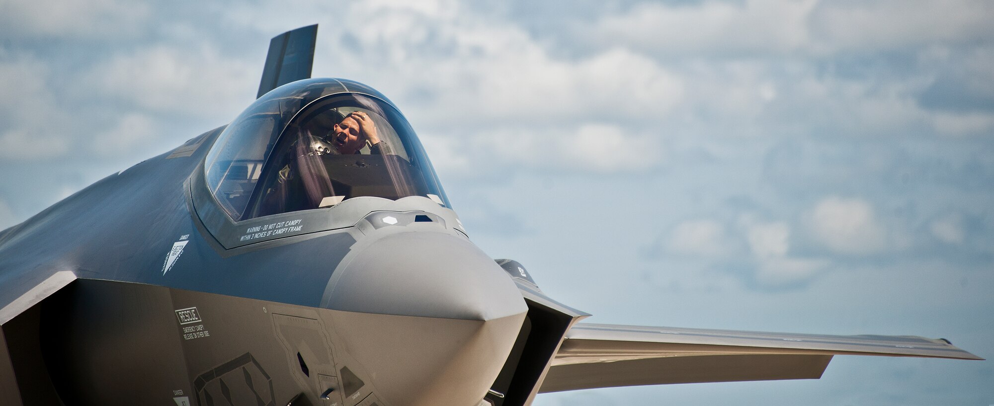 An Air Force F-35A Lightning II pilot from the 58th Fighter Squadron takes a momentary breather while his aircraft is being refueled a hot pit session on the 33rd Fighter Wing flightline at Eglin Air Force Base, Fla.  Airmen, Marines and Sailors are refueling their F-35 variants for multiple sorties via 96th Test Wing fuel trucks while construction is completed on the 33rd’s hot pit area.  (U.S. Air Force photo/Samuel King Jr.)