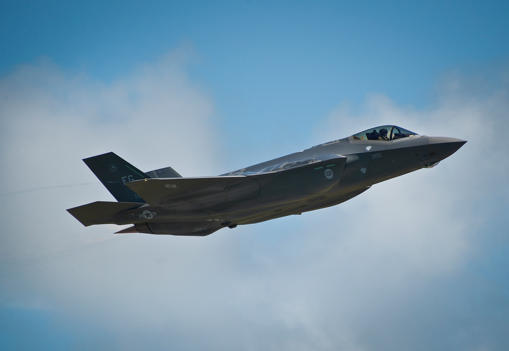 An F-35A Lightning II takes off from the Eglin Air Force Base runway after a hot pit refuel.  Airmen, Marines and Sailors are refueling their F-35 variants for multiple sorties via 96th Test Wing fuel trucks while construction is completed on the 33rd’s hot pit area.  (U.S. Air Force photo/Samuel King Jr.)