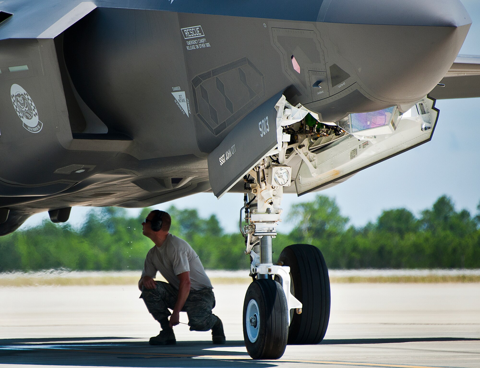 A maintainer from the 33rd Aircraft Maintenance Squadron, monitors preflight checks on an F-35A Lightning II after a hot pit session on the 33rd Fighter Wing flightline at Eglin Air Force Base, Fla.  Airmen, Marines and Sailors are refueling their F-35 variants for multiple sorties via 96th Test Wing fuel trucks while construction is completed on the 33rd’s hot pit area.  (U.S. Air Force photo/Samuel King Jr.)