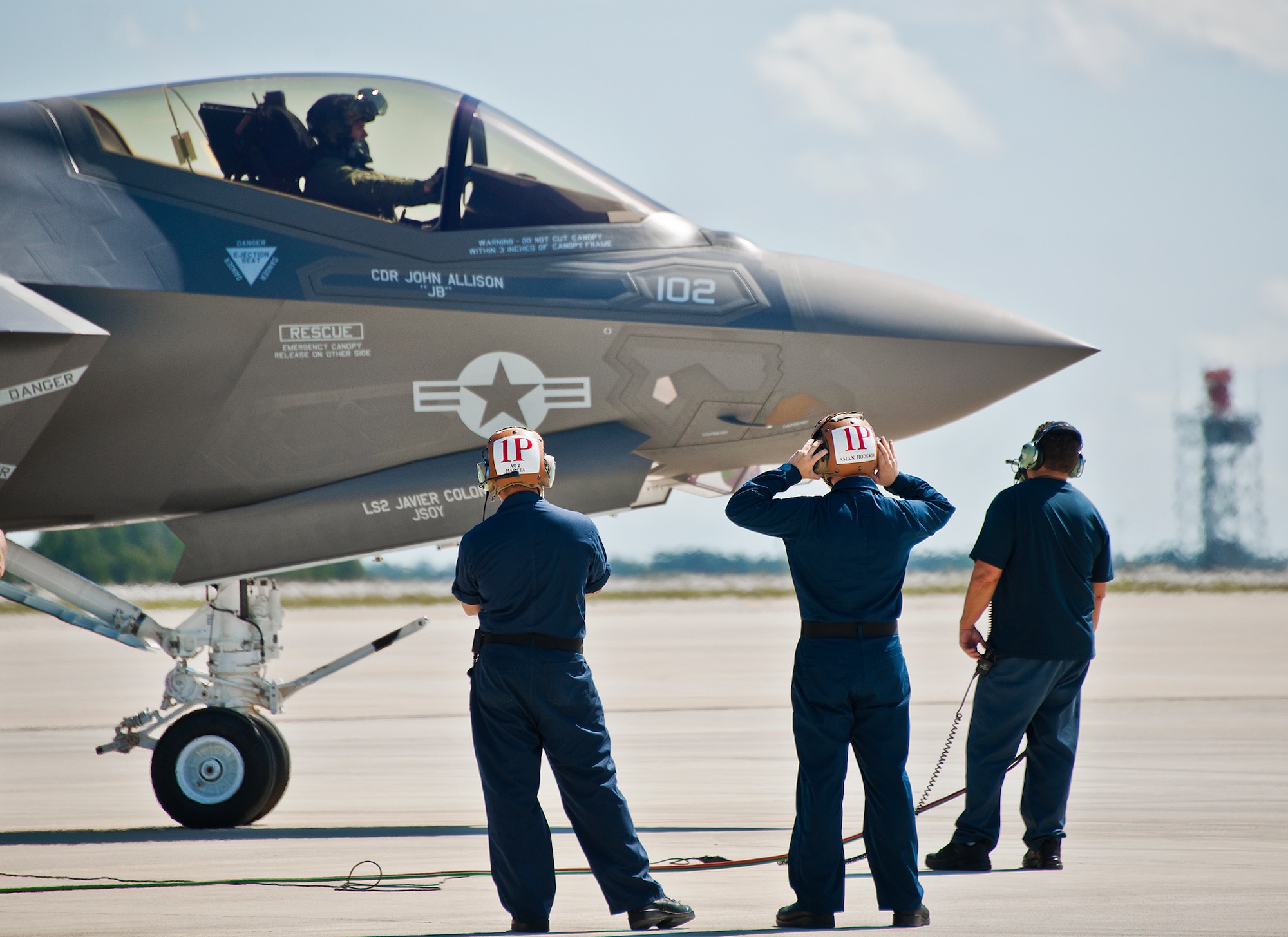 Sailors from the Strike Fighter Squadron-101, perform preflight checks on an F-35C Lightning II after a hot pit session on the 33rd Fighter Wing flightline at Eglin Air Force Base, Fla.  Airmen, Marines and Sailors are refueling their F-35 variants for multiple sorties via 96th Test Wing fuel trucks while construction is completed on the 33rd’s hot pit area.  (U.S. Air Force photo/Samuel King Jr.)