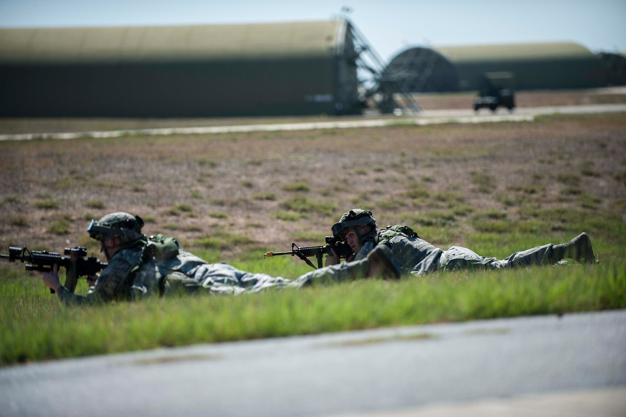 Airmen assigned to the 39th Security Forces Squadron lay on the ground for cover from "enemy forces" during force-on-force training exercise Sept. 25, 2013, at Incirlik Air Base, Turkey. The 39th SFS Airmen participated in the exercise which challenged Airmen with possible real-world situations. (U.S. Air Force photo by Airman 1st Class Nicole Sikorski/Released)