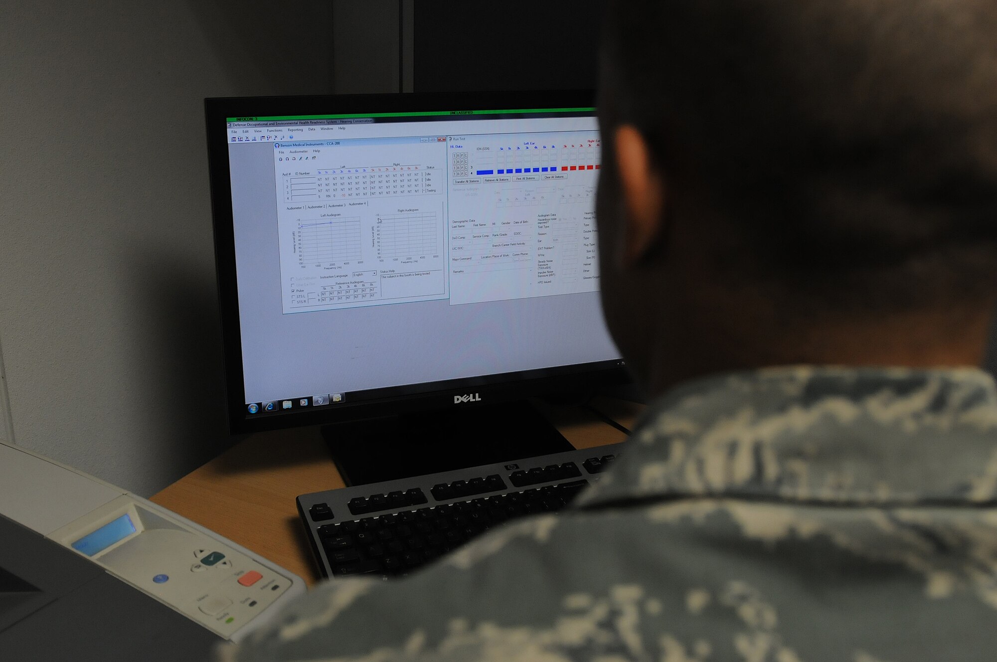 Airman 1st Class Allen Cherry, 86th Medical Group public health technician, reviews scores from a hearing test to see if a patient needs better hearing protection, Oct. 1, 2013, Ramstein Air Base, Germany. The occupational health office offers hearing tests for military members who work in industrial hazard environments to ensure their hearing is at the right level to accomplish the mission. (U.S. Air Force photo/Airman 1st Class Holly Mansfield)