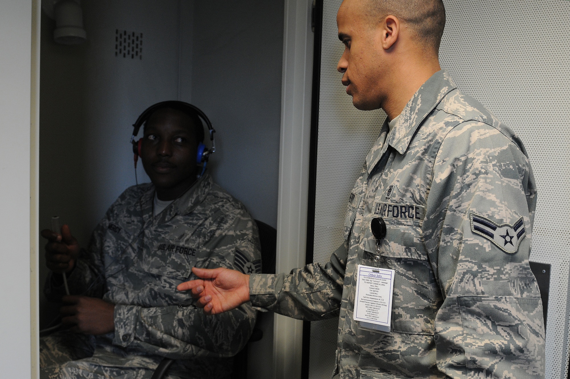 Staff Sgt. Alton Mercy, 86th Medical Group public health technician, receives information on how to administer a hearing test from Airman 1st Class Allen Cherry, 86th MDG public health technician, in order to check if a patient’s hearing has changed, Oct. 1, 2013, Ramstein Air Base, Germany. The occupational health office offers hearing tests for military members who work in industrial hazard environments to ensure their hearing is at the right level to accomplish the mission. (U.S. Air Force photo/Airman 1st Class Holly Mansfield)