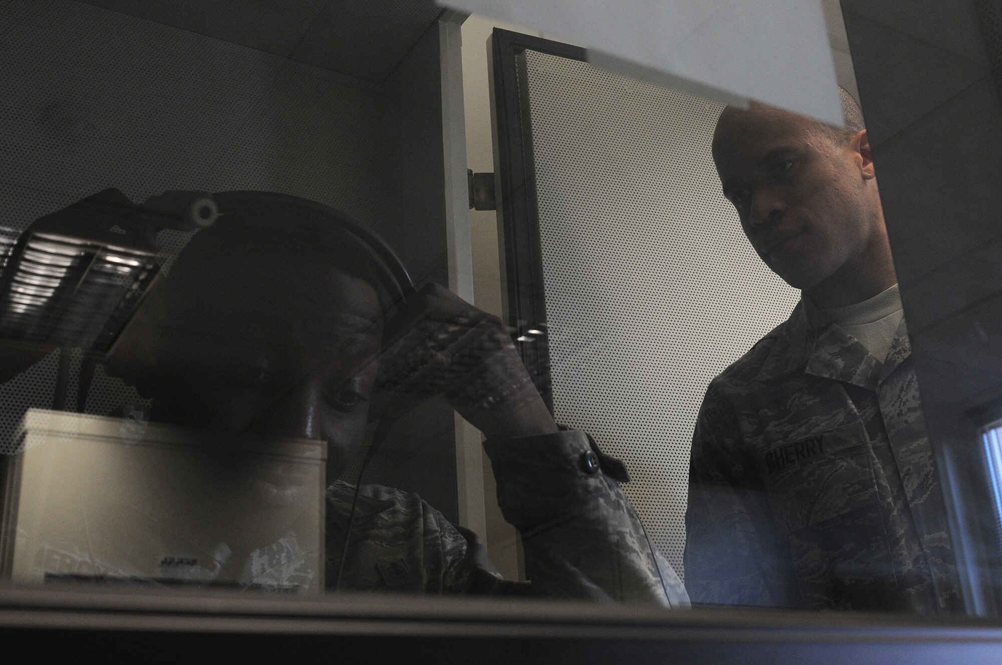 Staff Sgt. Alton Mercy, 86th Medical Group public health technician, receives information on how to administer a hearing test from Airman 1st Class Allen Cherry, 86th MDG public health technician, in order to check if a patient’s hearing has changed, Oct. 1, 2013, Ramstein Air Base, Germany. The occupational health office offers hearing tests for military members who work in industrial hazard environments to ensure their hearing is at the right level to accomplish the mission. (U.S. Air Force photo/Airman 1st Class Holly Mansfield)